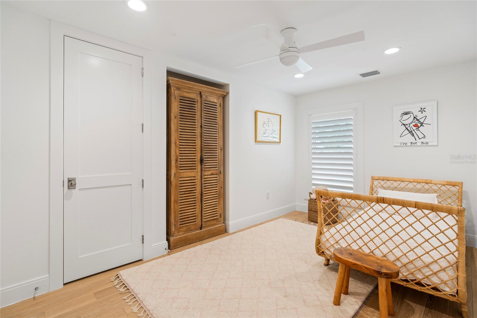 Bedroom 4 with shel stone flooring and double closets, virtually staged