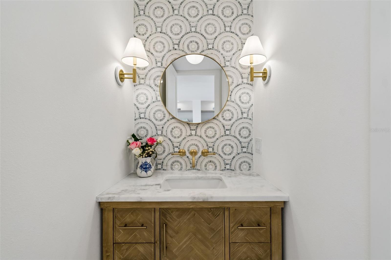 Powder room w/mosaic tile backsplash, upscale fixtures and lighting