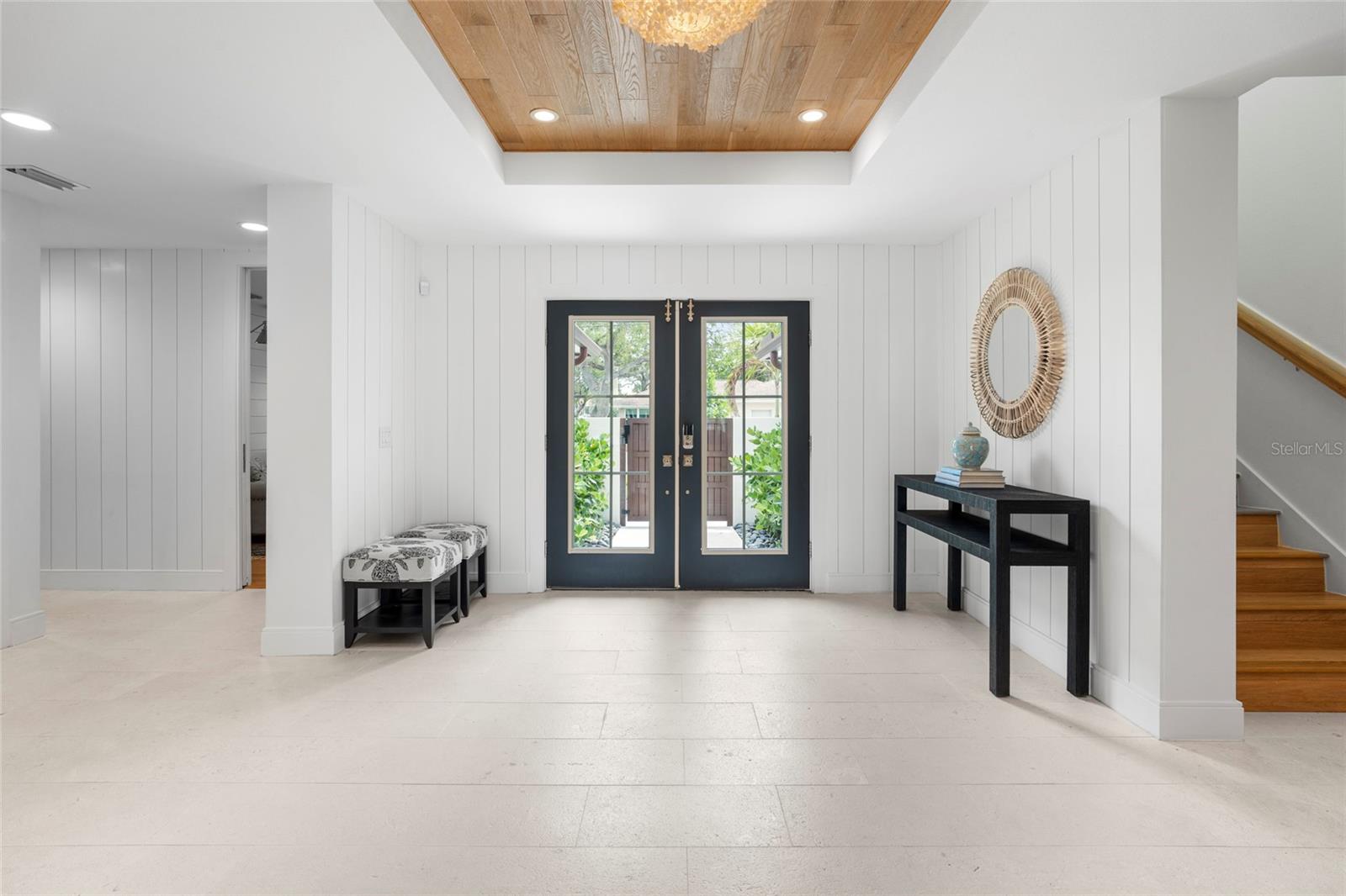 Shell Stone Tile and solid wood flooring throughout