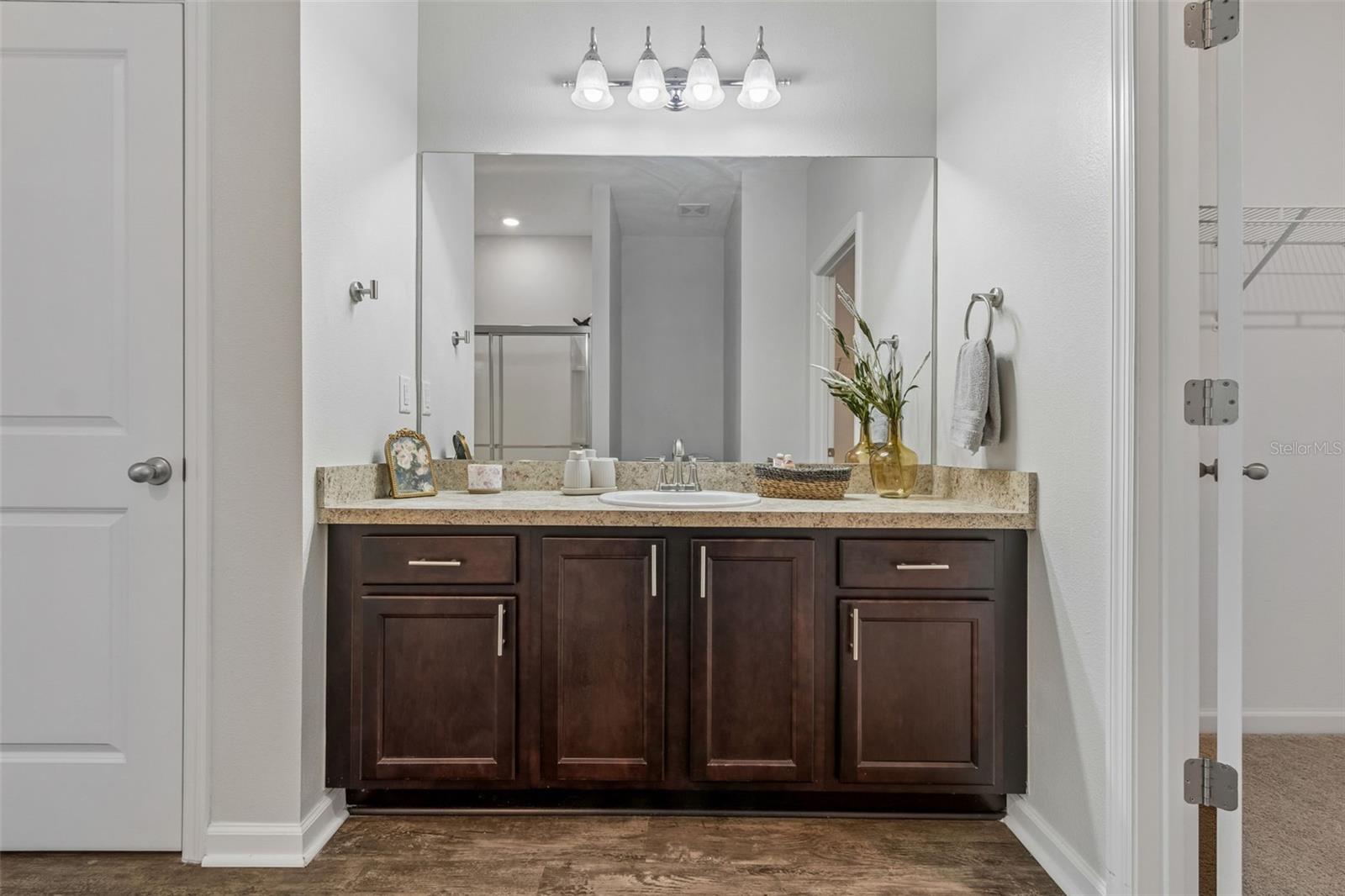 Generous cabinetry and mirror