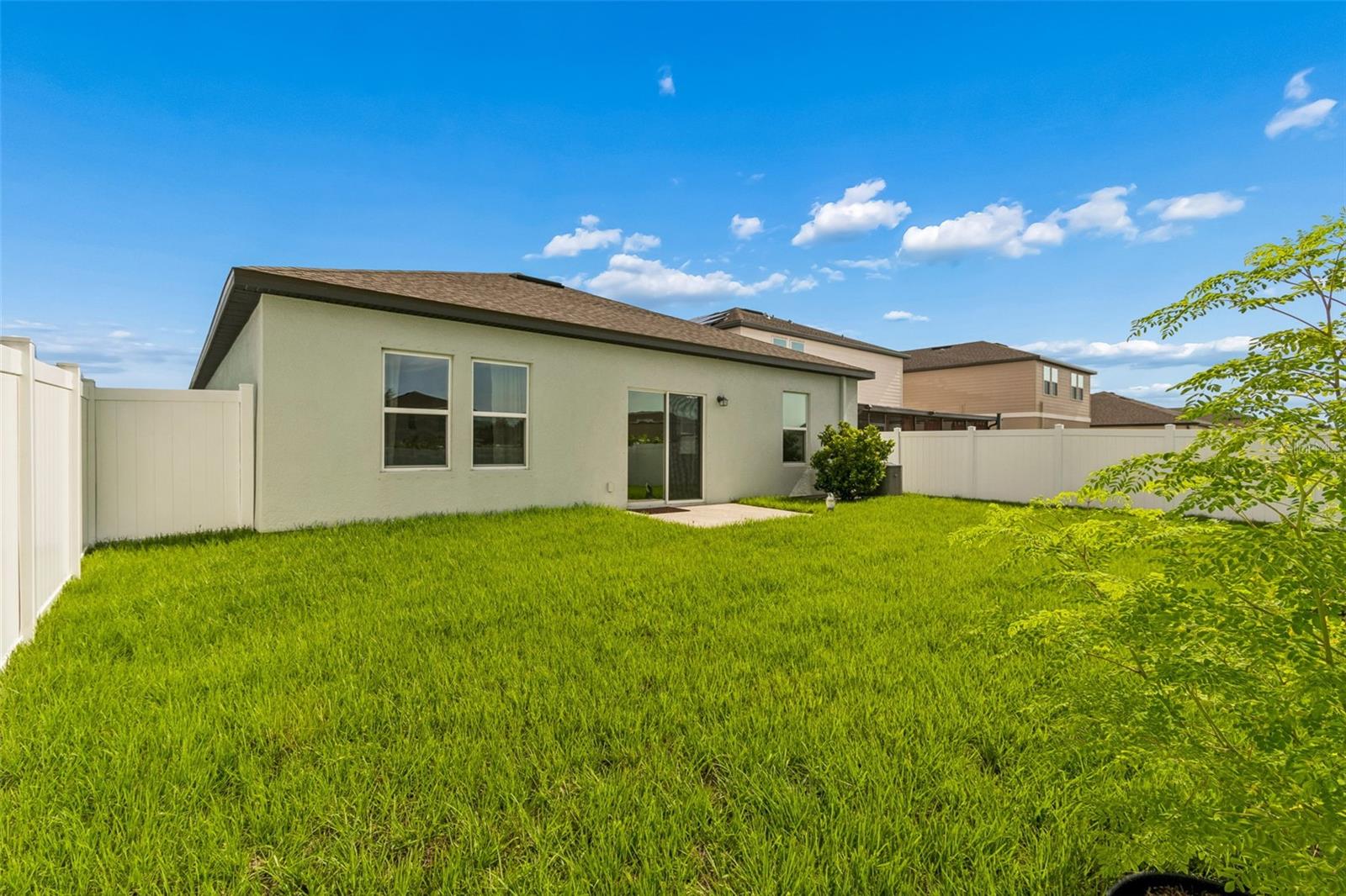 Backyard featuring lush lawn. Ready to build your own garden!