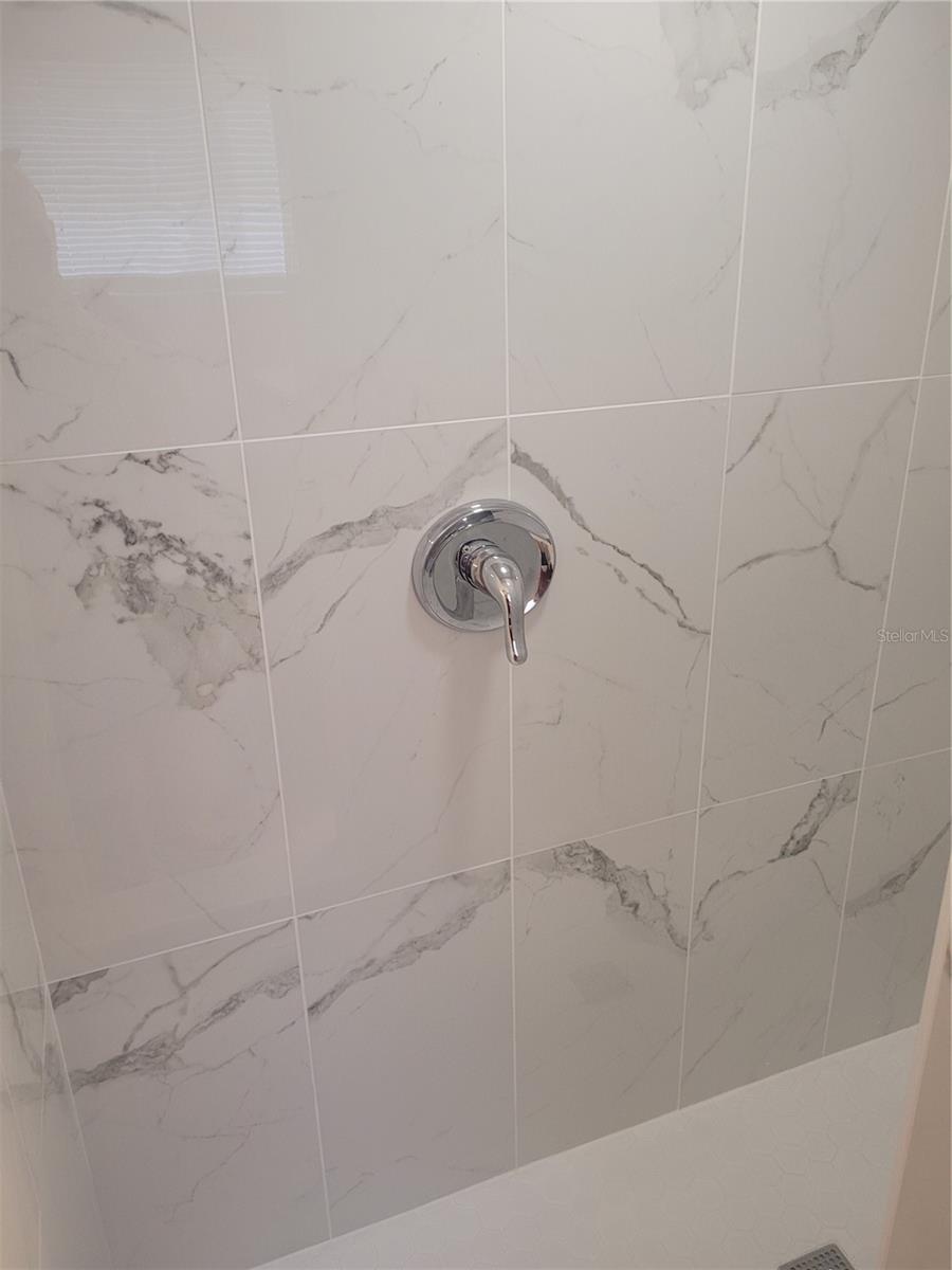 remodeled guest bathroom with walk in shower