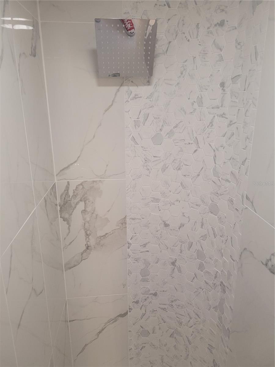 remodeled guest bathroom walk in shower