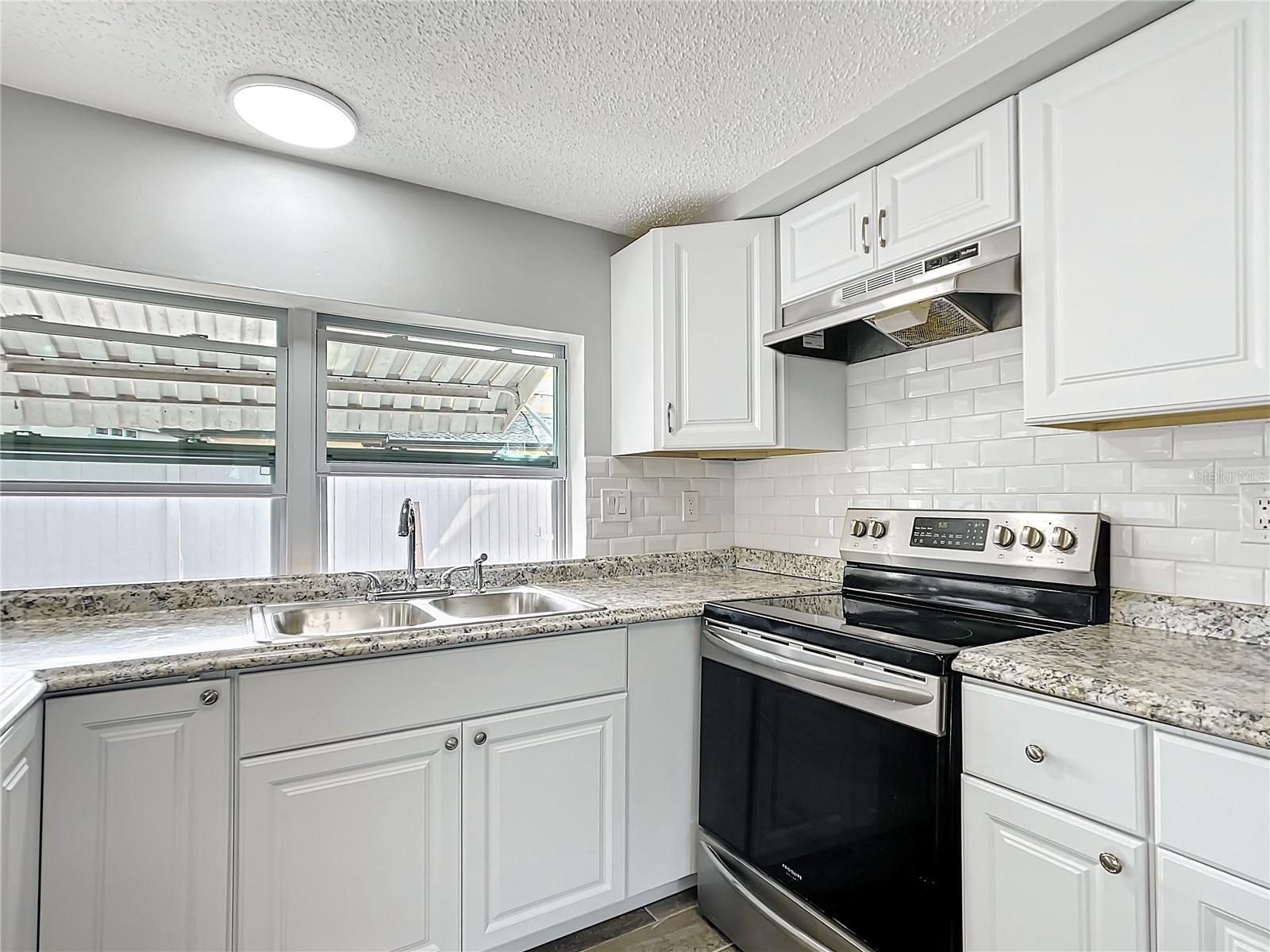 remodeled kitchen with SS appliances.