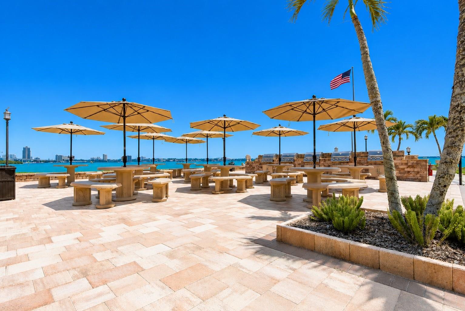 Outdoor grills, dining fire pit and private beach.