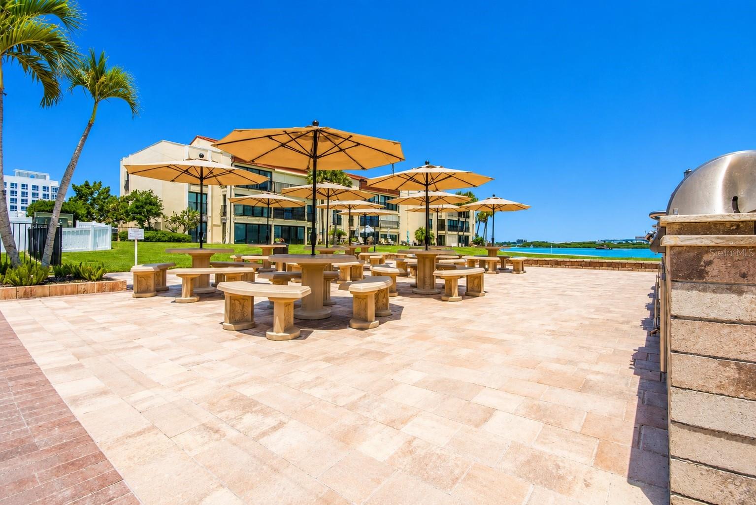 Outdoor grills, dining fire pit and private beach.