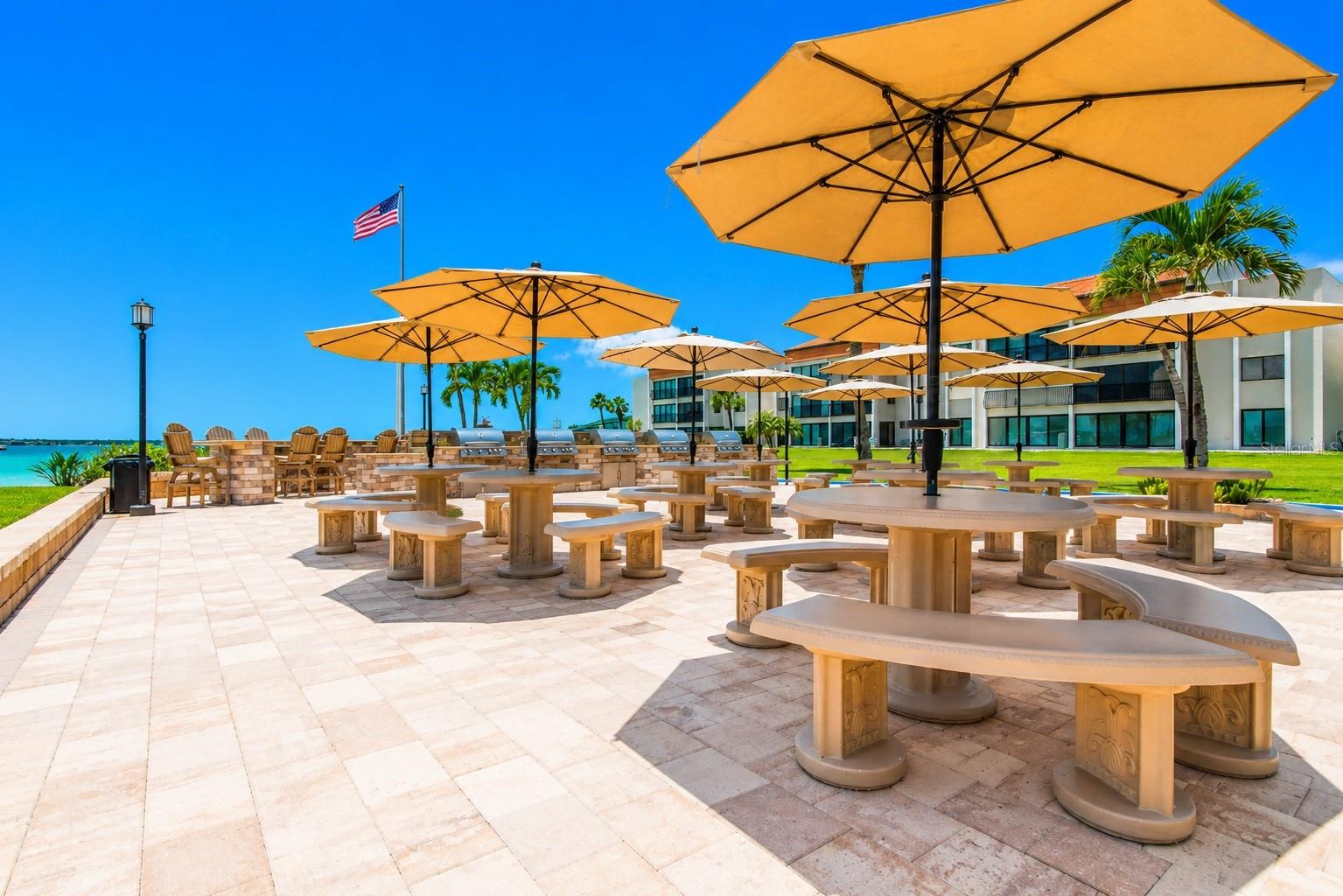 Outdoor grills, dining fire pit and private beach.