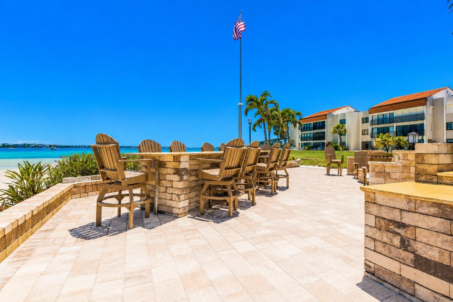 Outdoor grills, dining fire pit and private beach.