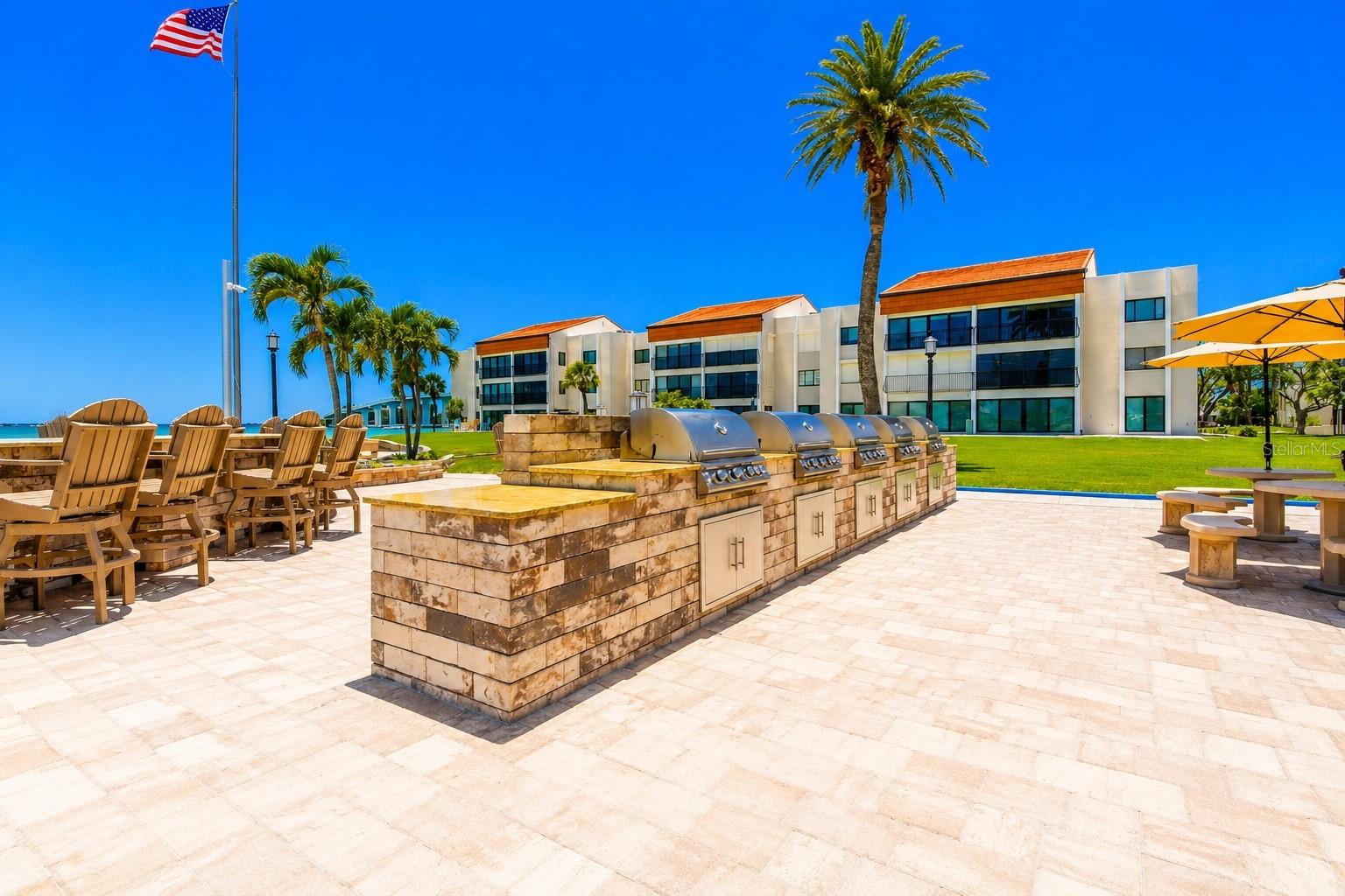 Outdoor grills, dining fire pit and private beach.