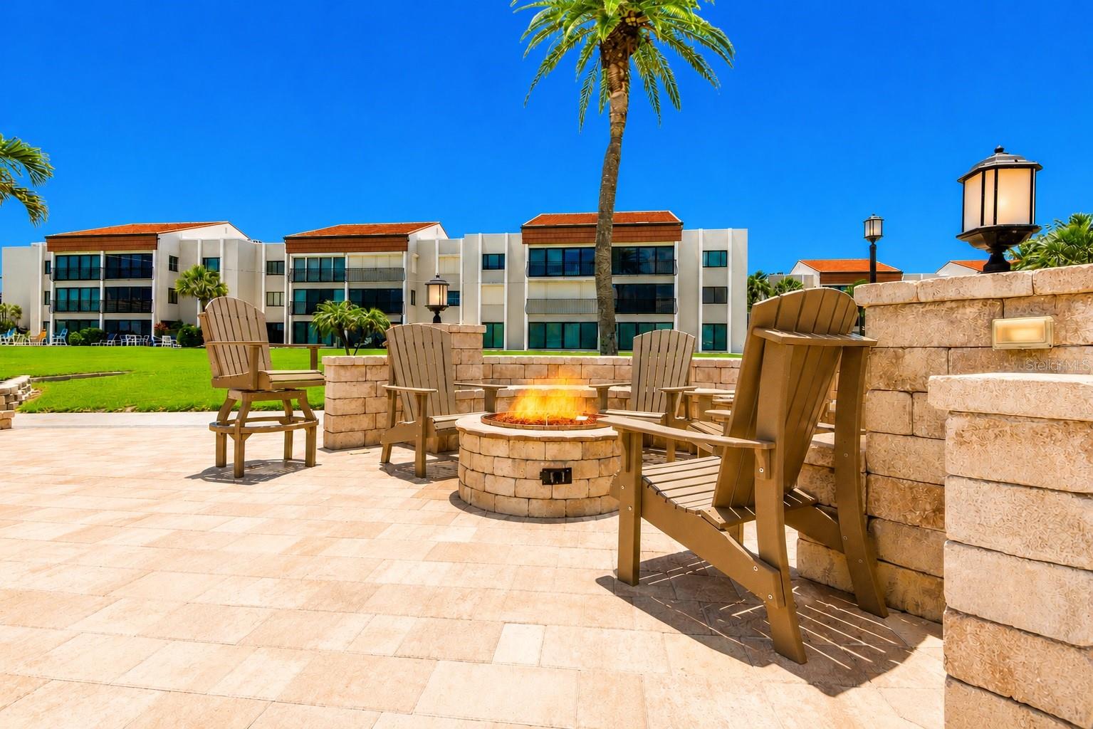 Outdoor grills, dining fire pit and private beach.