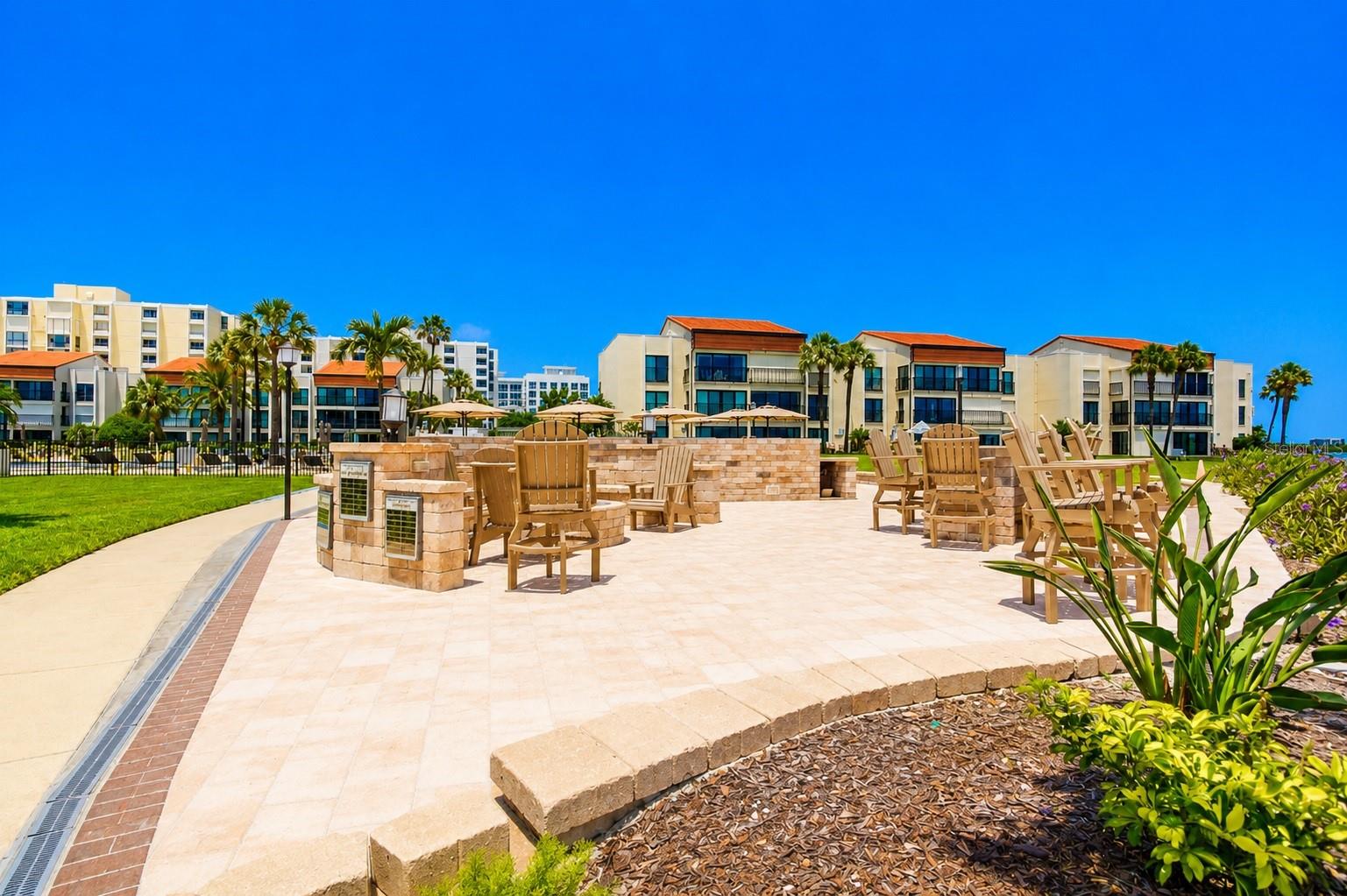 Outdoor grills, dining fire pit and private beach.