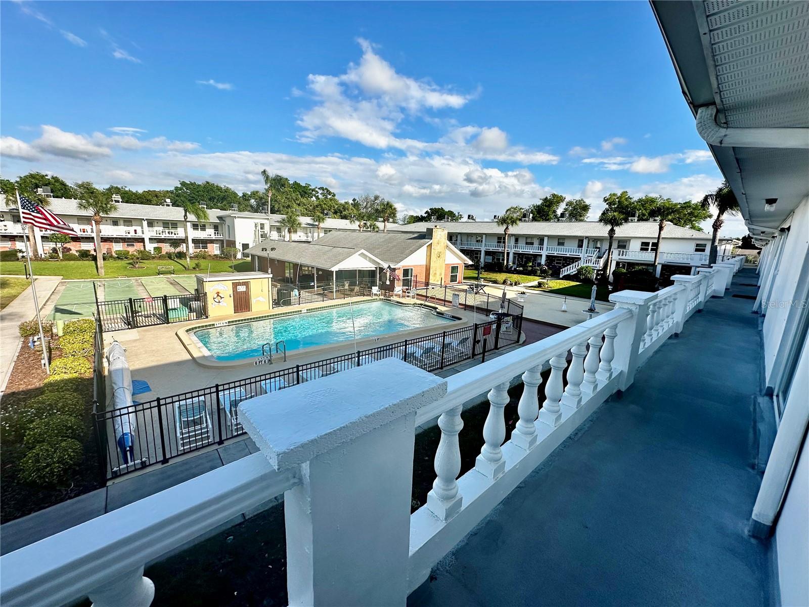 View from Florida Room to Pool Courtyard and Clubhouse