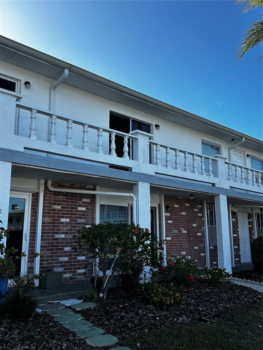 Exterior Back View Unit Showing on 2nd Level from Ground