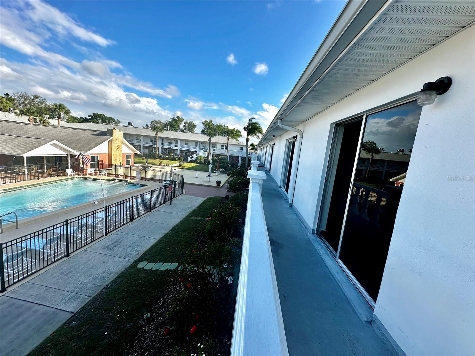Rear Sliding Doors Showing View of Pool from Unit