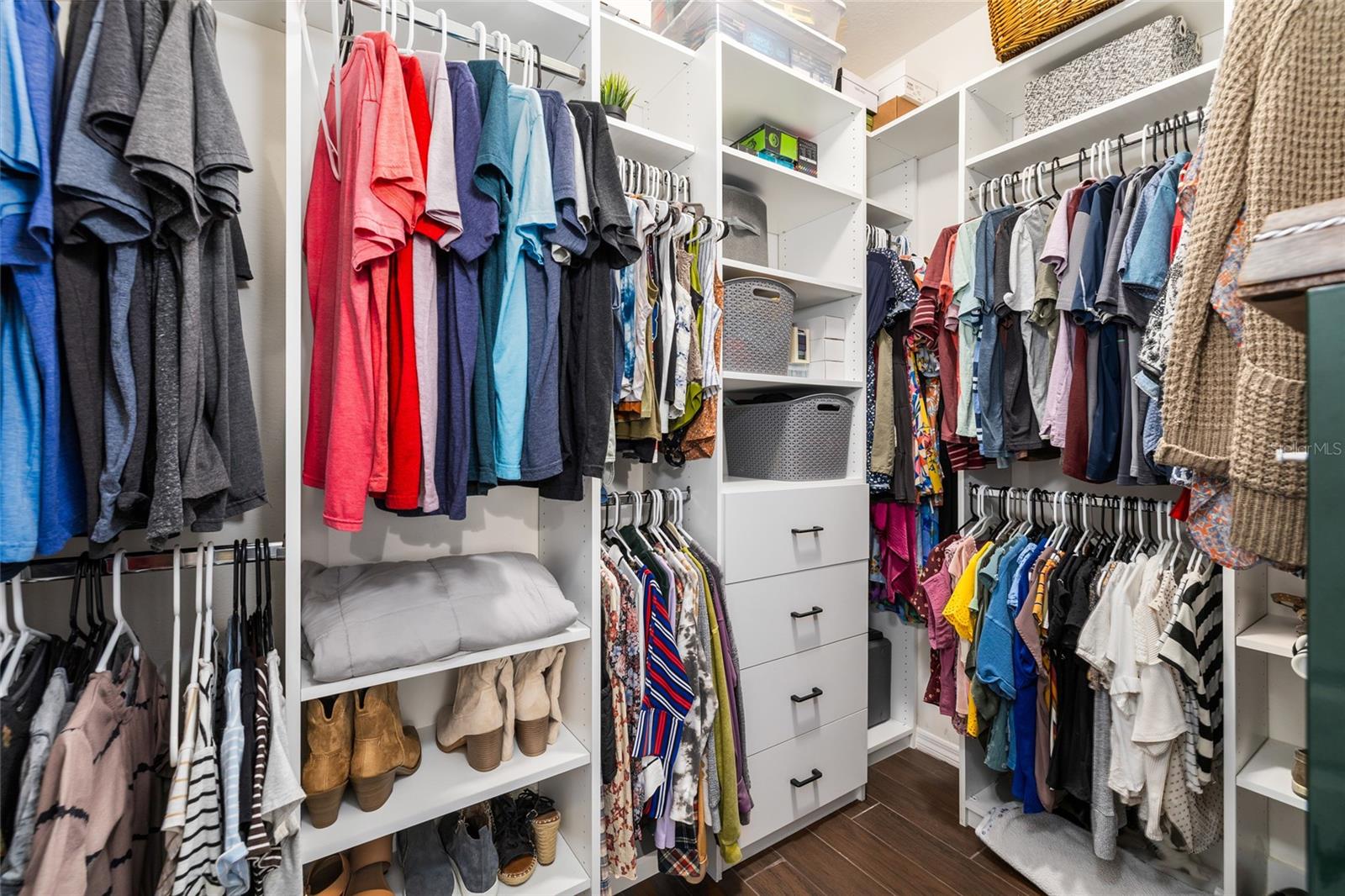 Primary Bedroom walk-in closet with Closet Organizer