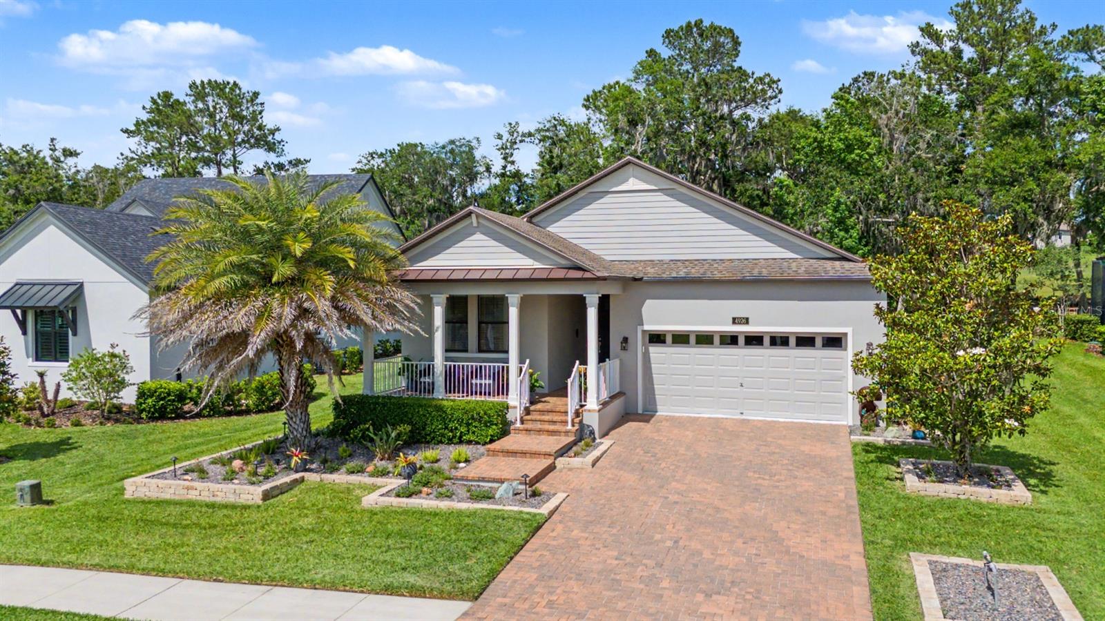 Brick landscaped beds, premium lighting and lush sod add to the appeal!