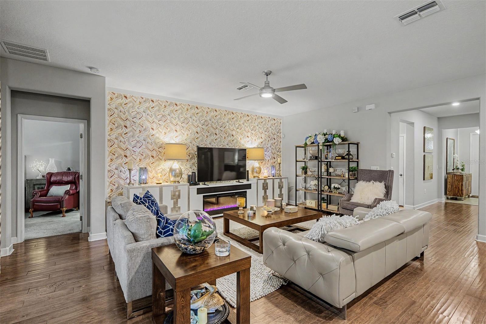 Former model home with accent wall and wood floors in Great Room!