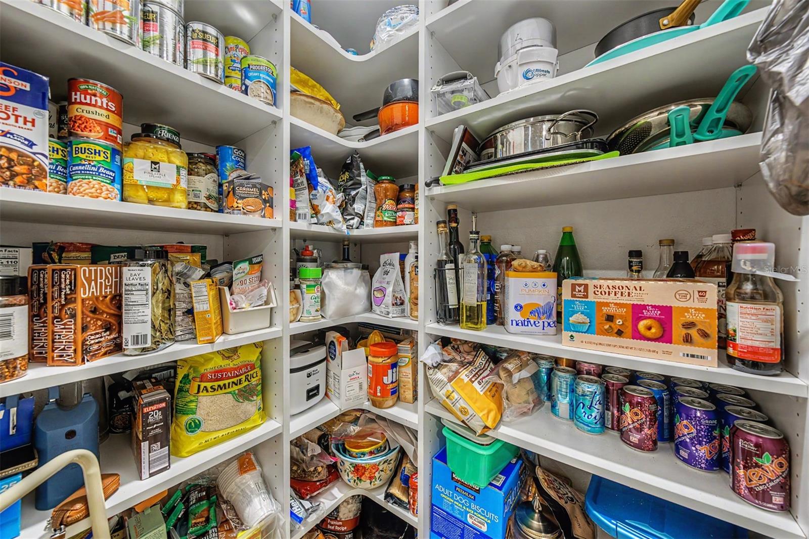 Wooden shelves in kitchen closet pantry