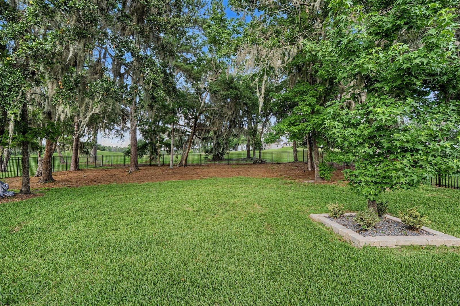 Lush, fenced backyard setting