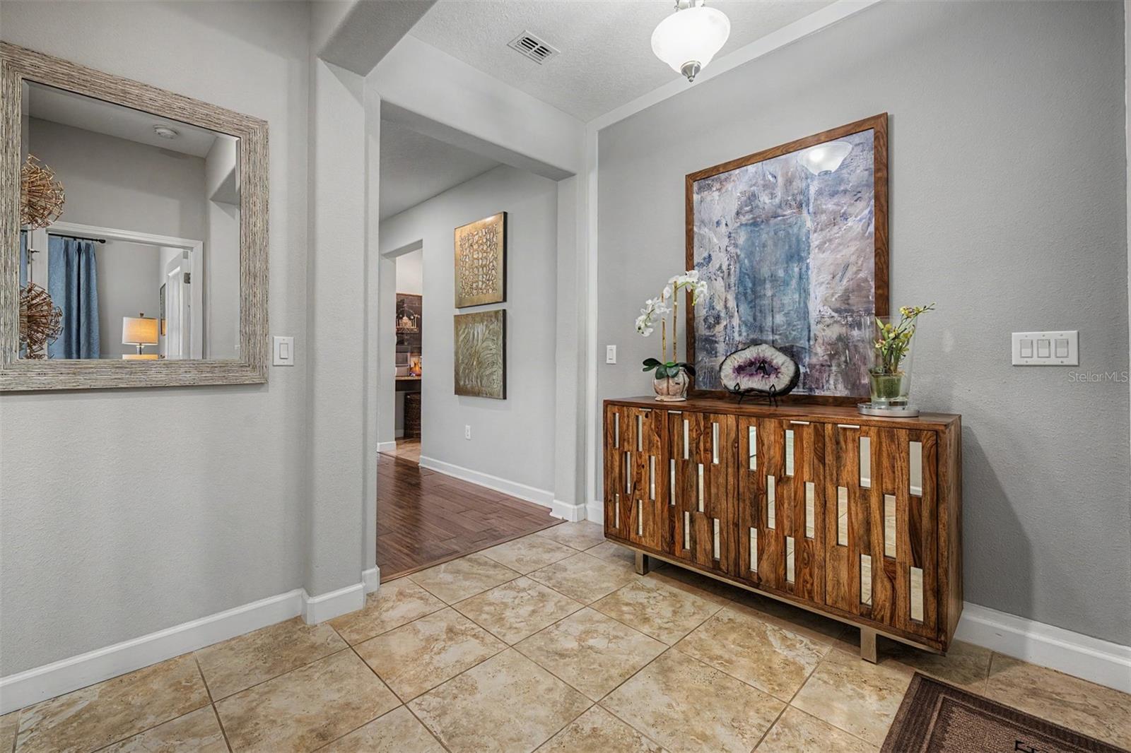 Foyer welcomes you in with framed accent wall!