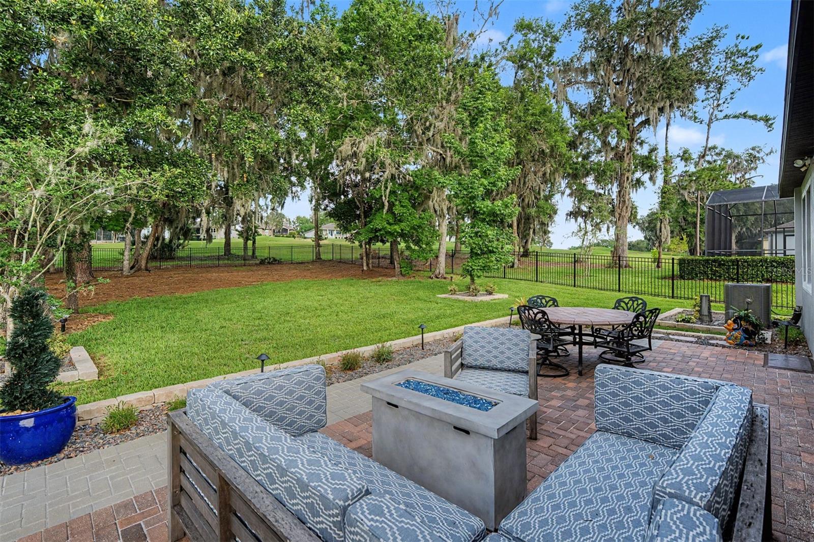 Extra OPEN back patio off screened lanai to extend entertaining space!
