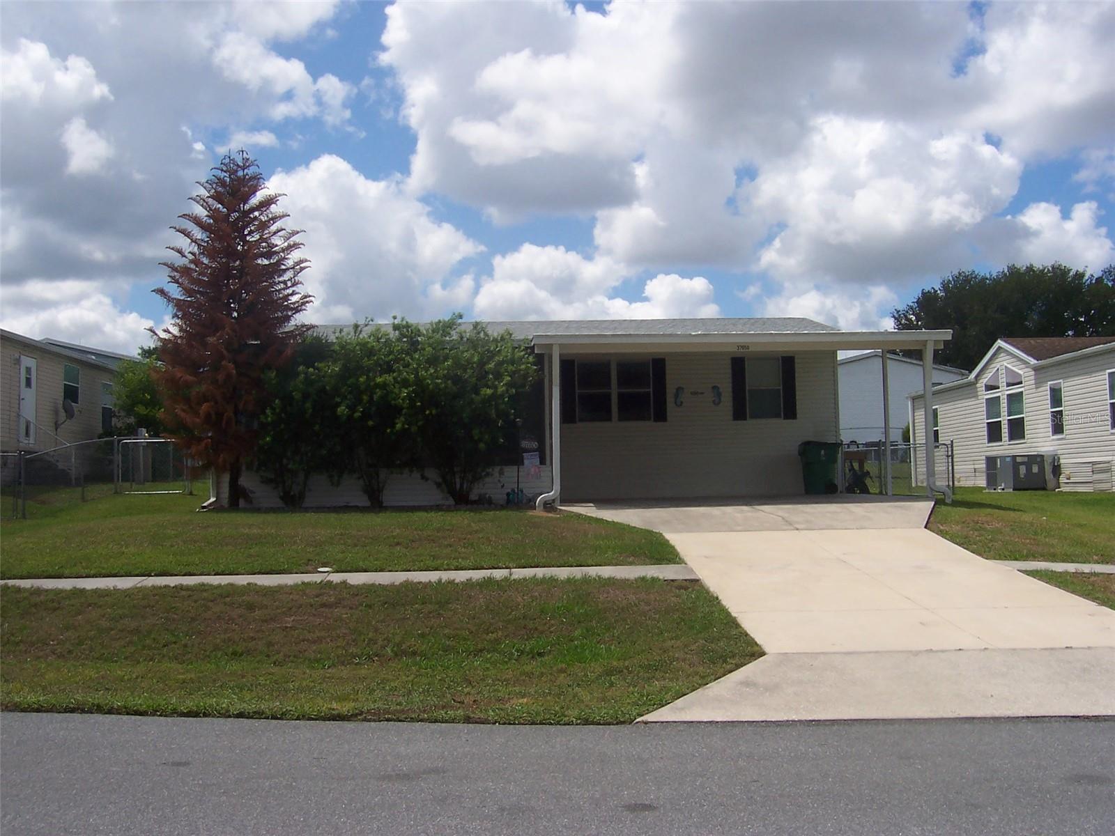 Sides and back of home are fenced.