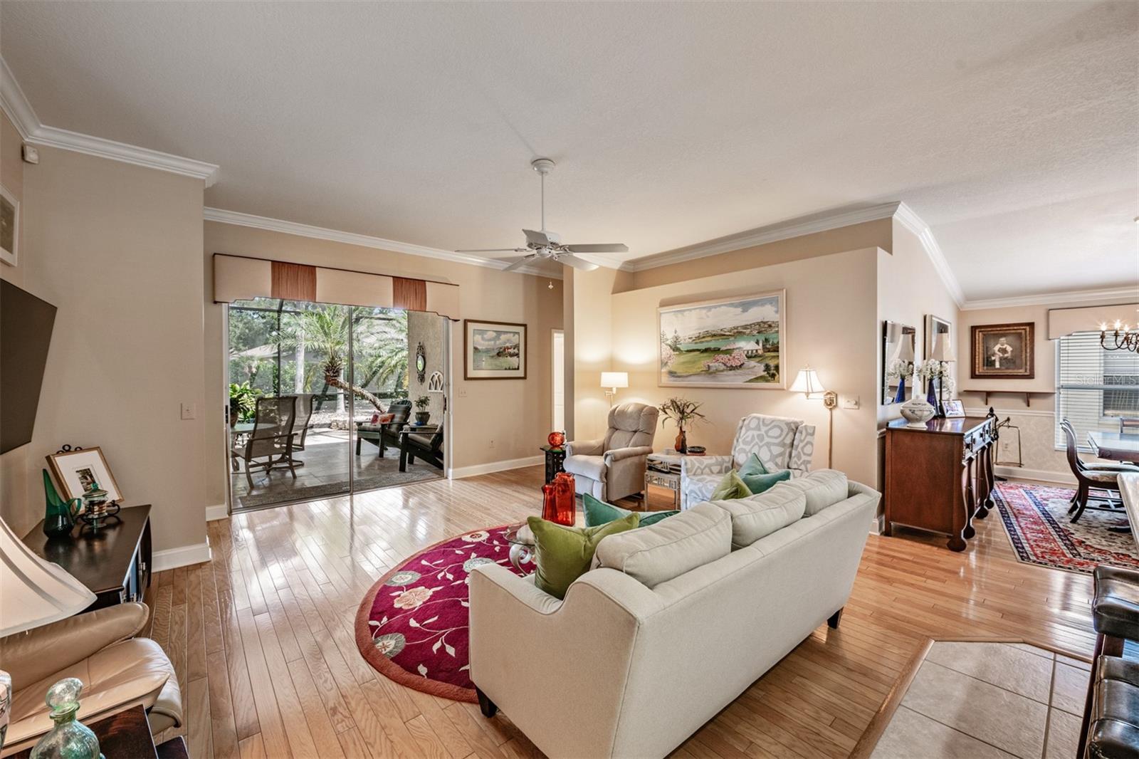 Large Family Room, Crown Molding, Hardwood Flooring, Ceiling Fan, this room is open to the Kitchen and Dining Room.