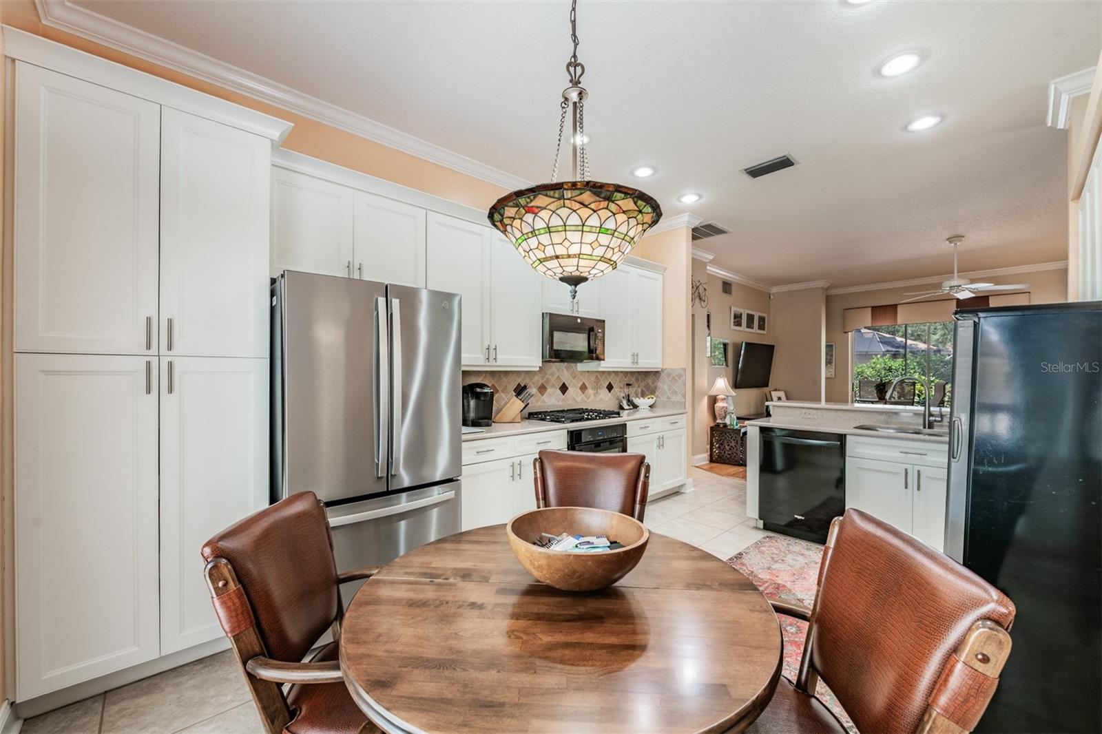 Eat in space in the Kitchen, Stainless Steel Appliances Gas Range.