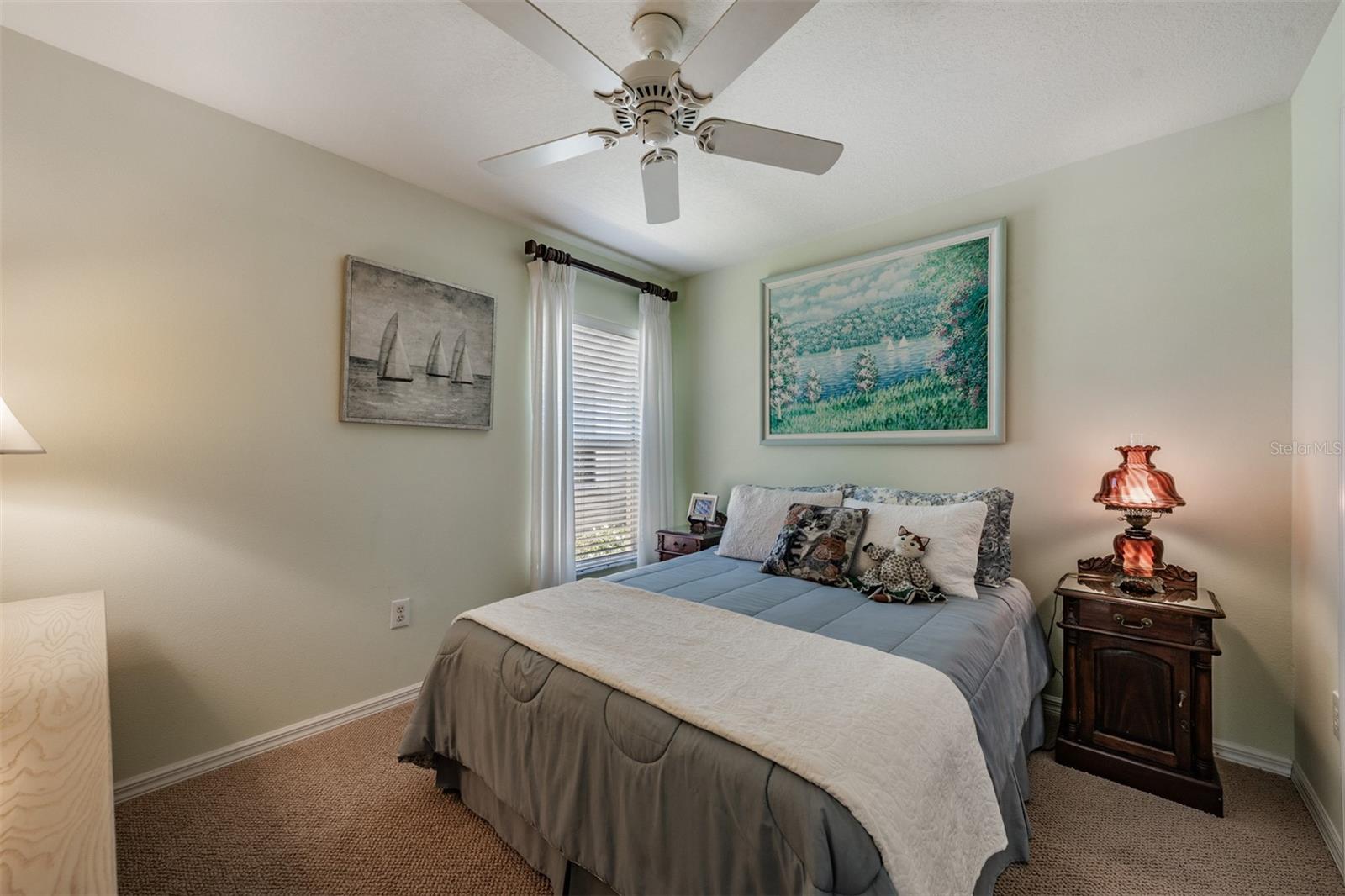 Guest Bedroom with a ceiling fan.