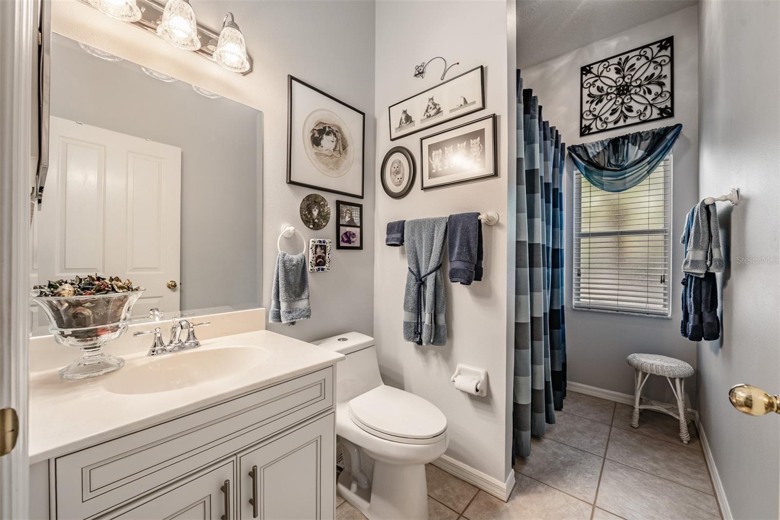 Guest Bathroom with a shower, Tile Flooring.