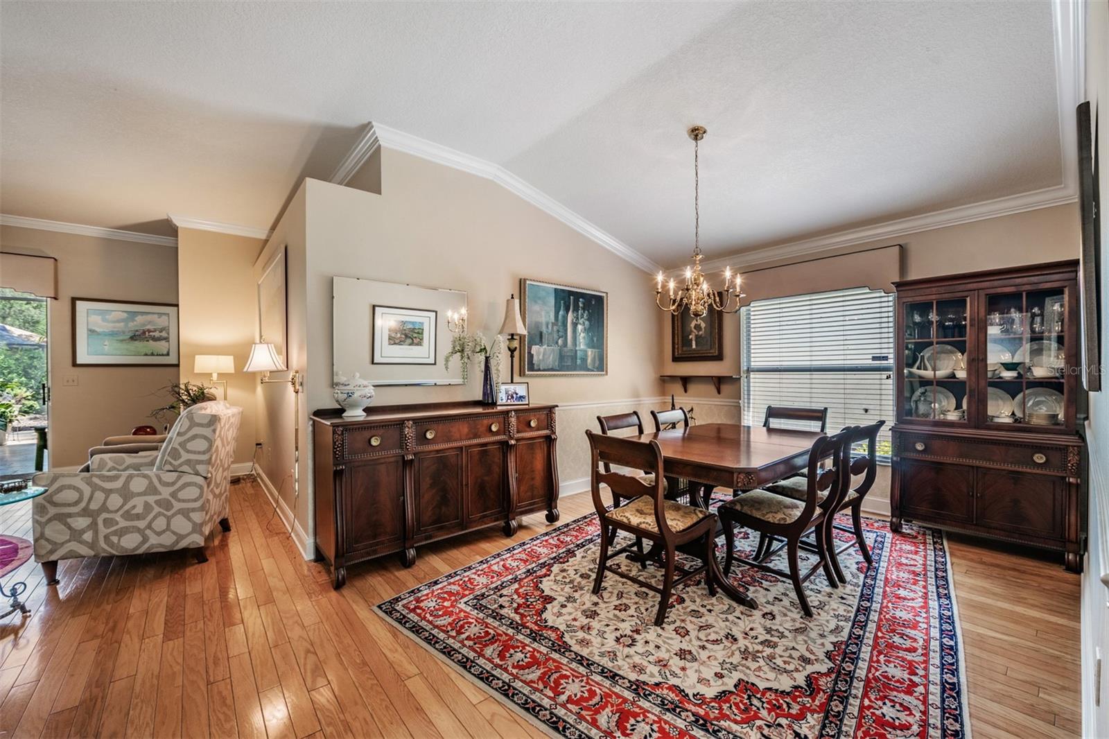 Spacious Dining Room Open to the Family Room, Hardwood Flooring, Crown Molding.