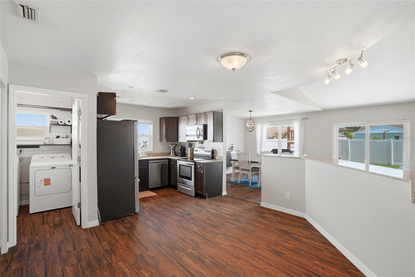 Open kitchen with eat in space for a breakfast nook, easy access laundry room off the garage