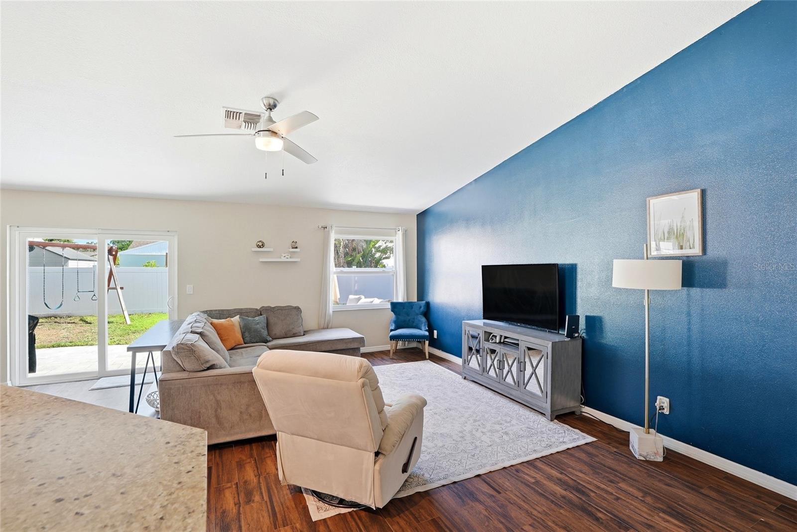 Living room with hurricane impact rated windows and doors