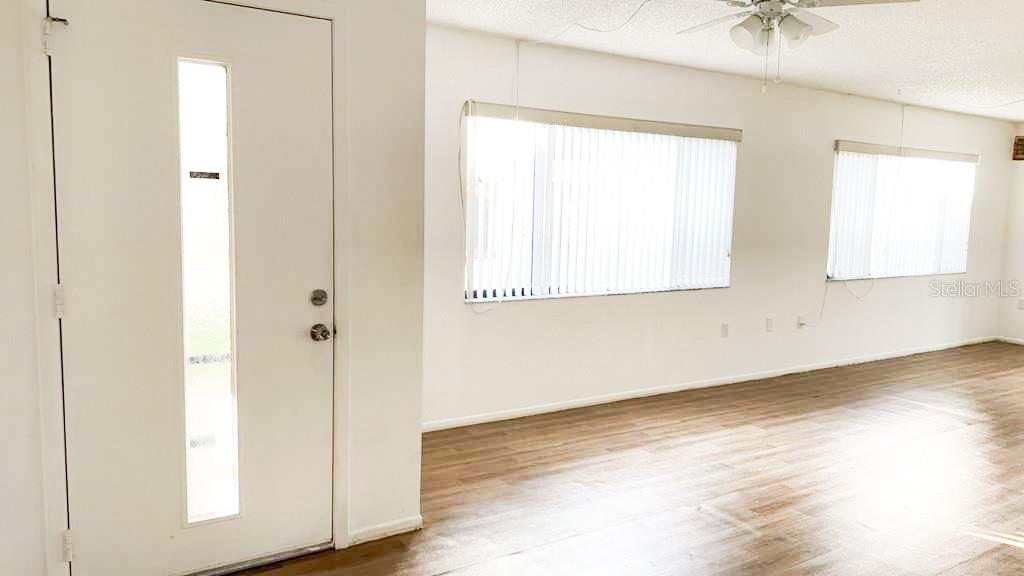 Front door and dining room living room windows