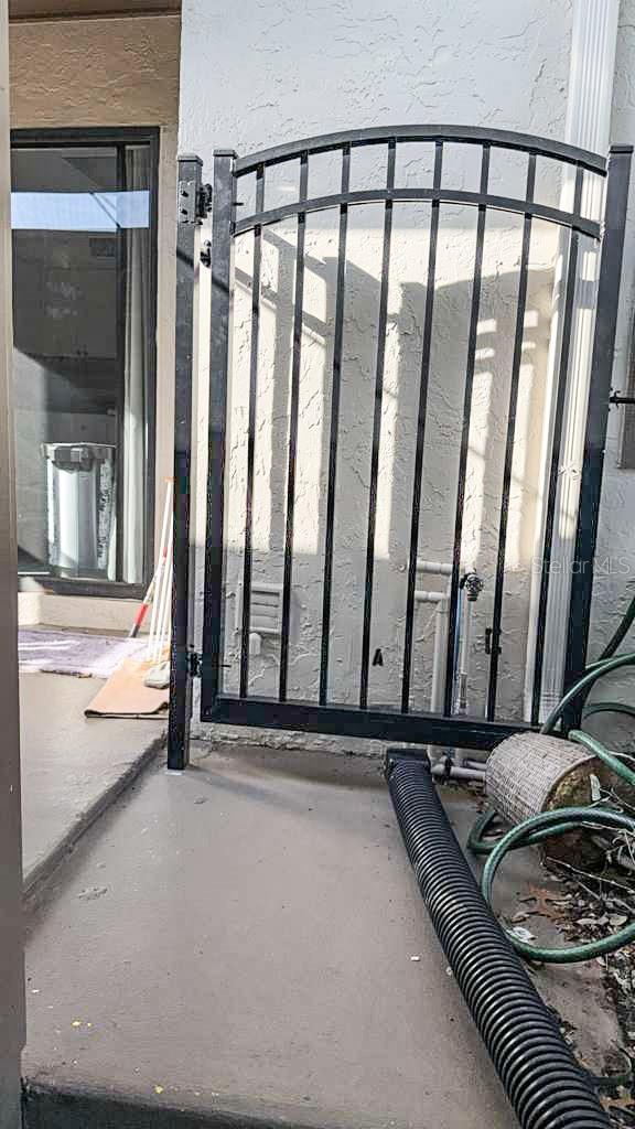 The gate to your private front patio/courtyard