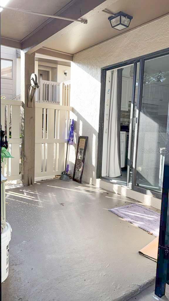 Private front entrance to patio straight into kitchen from the car port