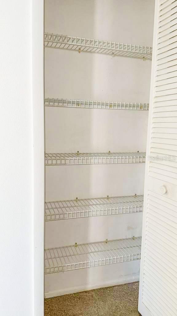 Linen closet in hall opposite second bathroom.