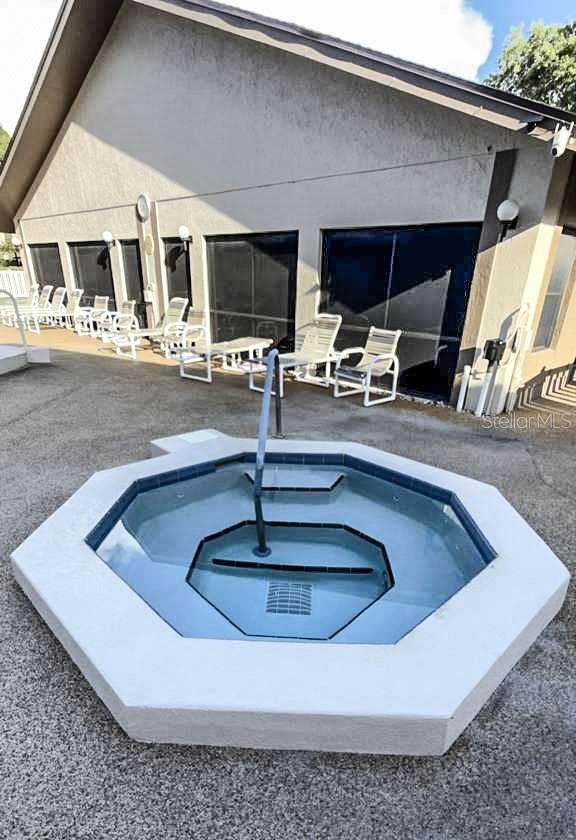 Jacuzzi and back of clubhouse