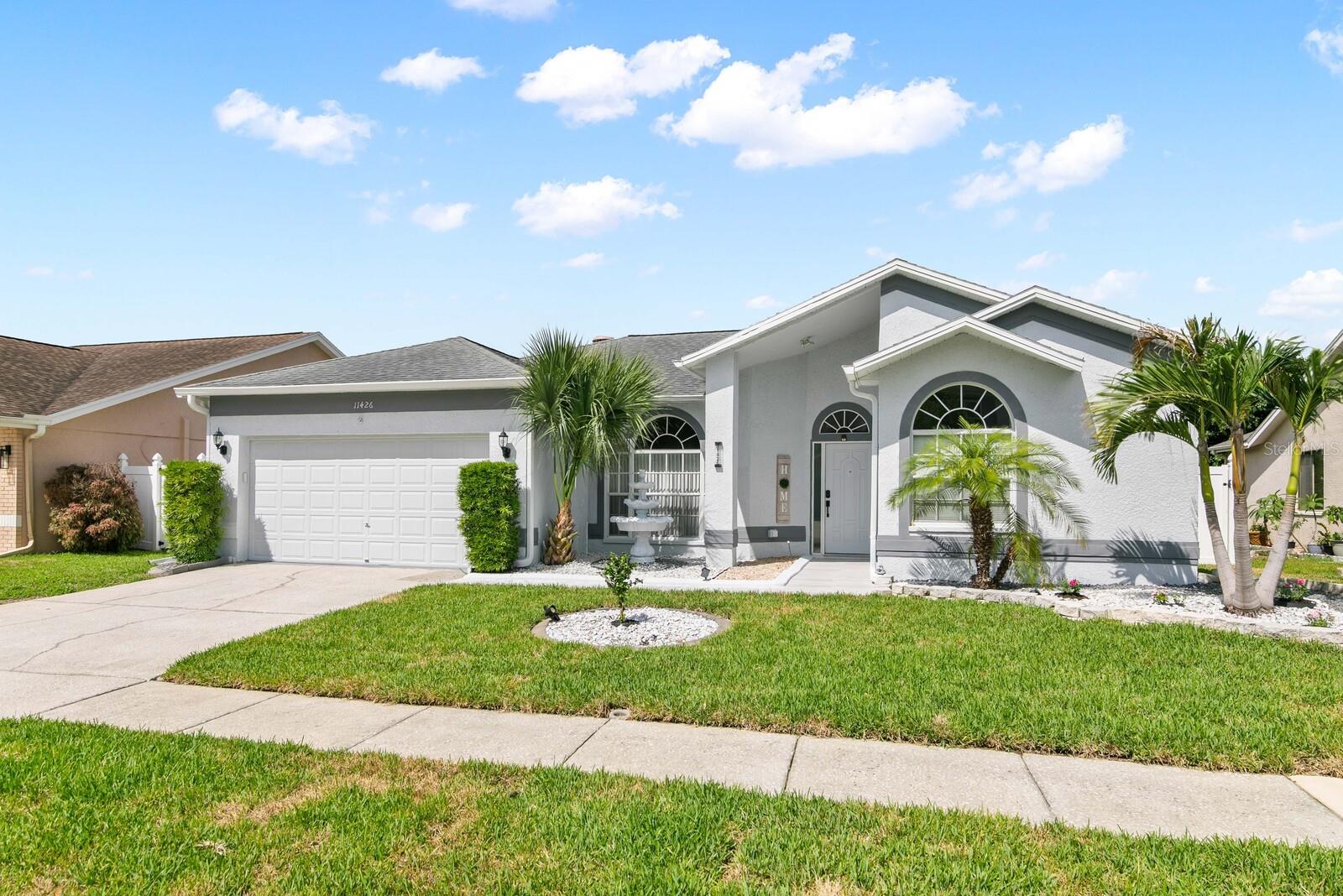 New Exterior Paint, Rocking, Curbing and Sod