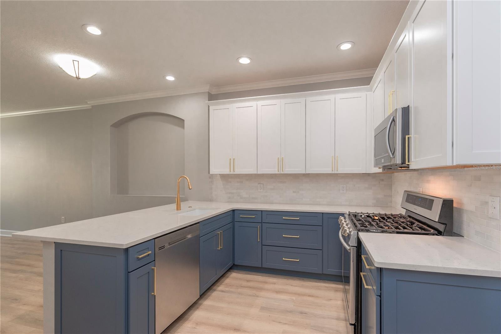 Kitchen with quarter counters.