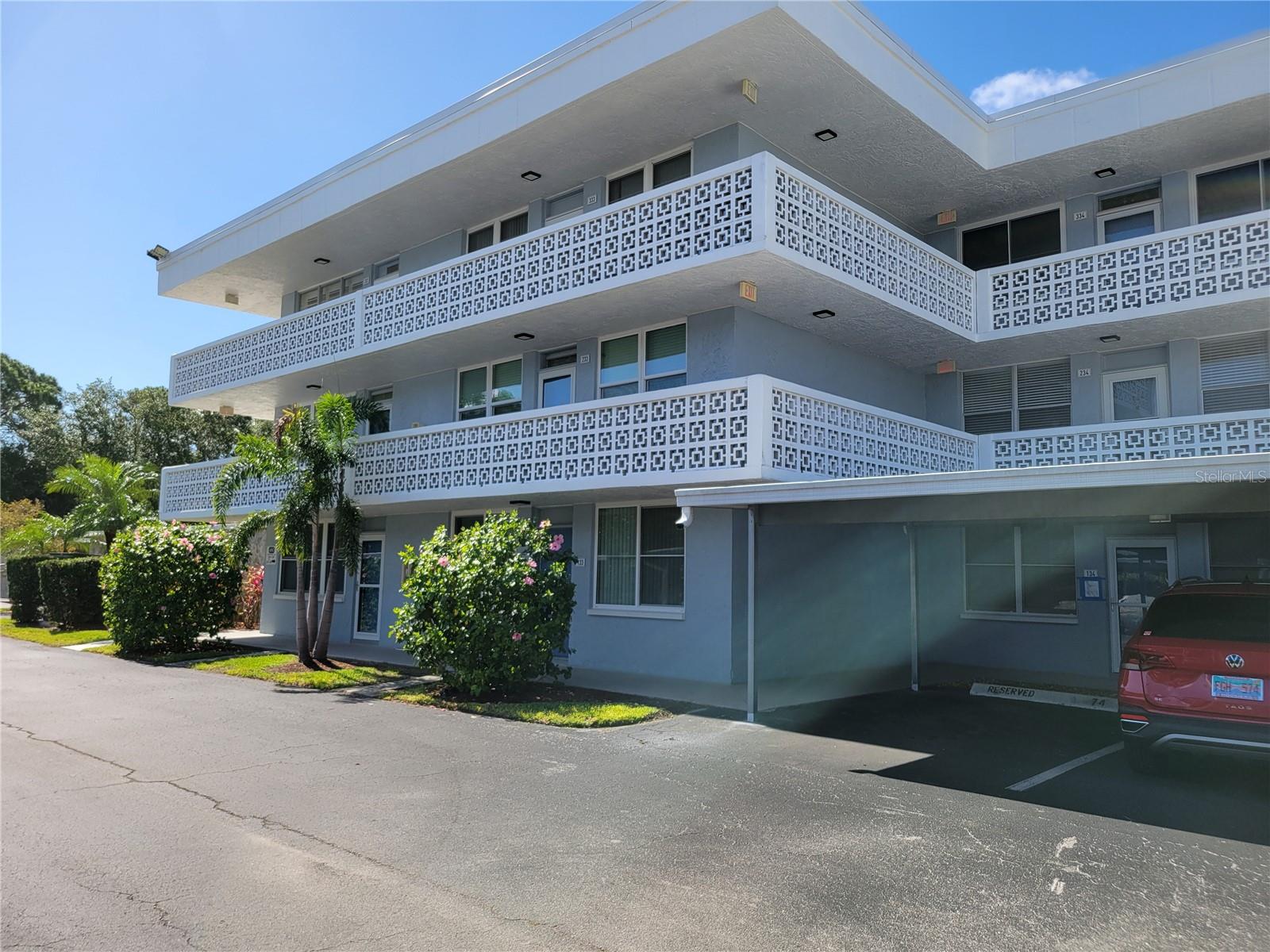 Covered walkway to laundry, storage and trash room