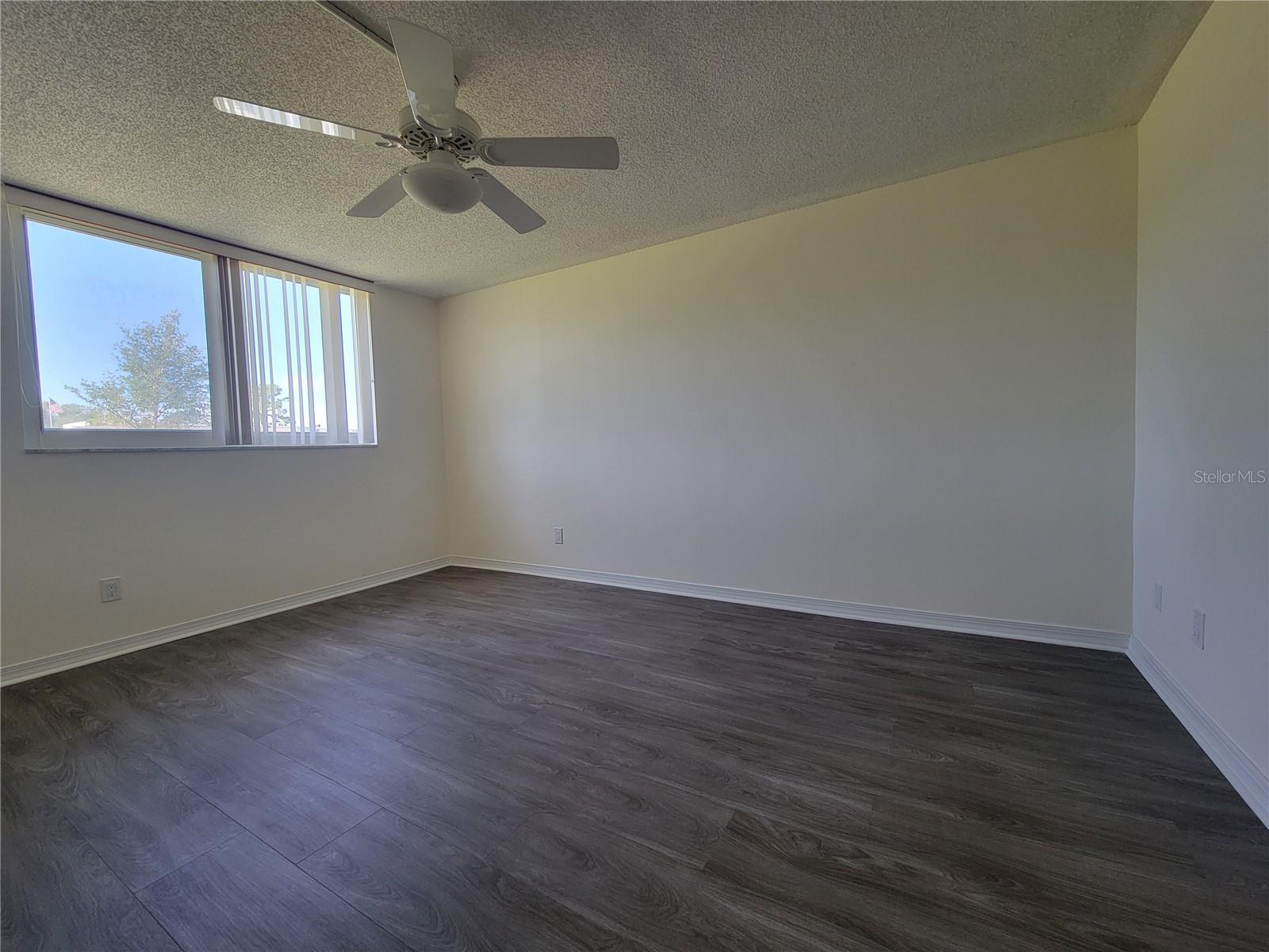 The primary bedroom offers both privacy and views of the courtyard.