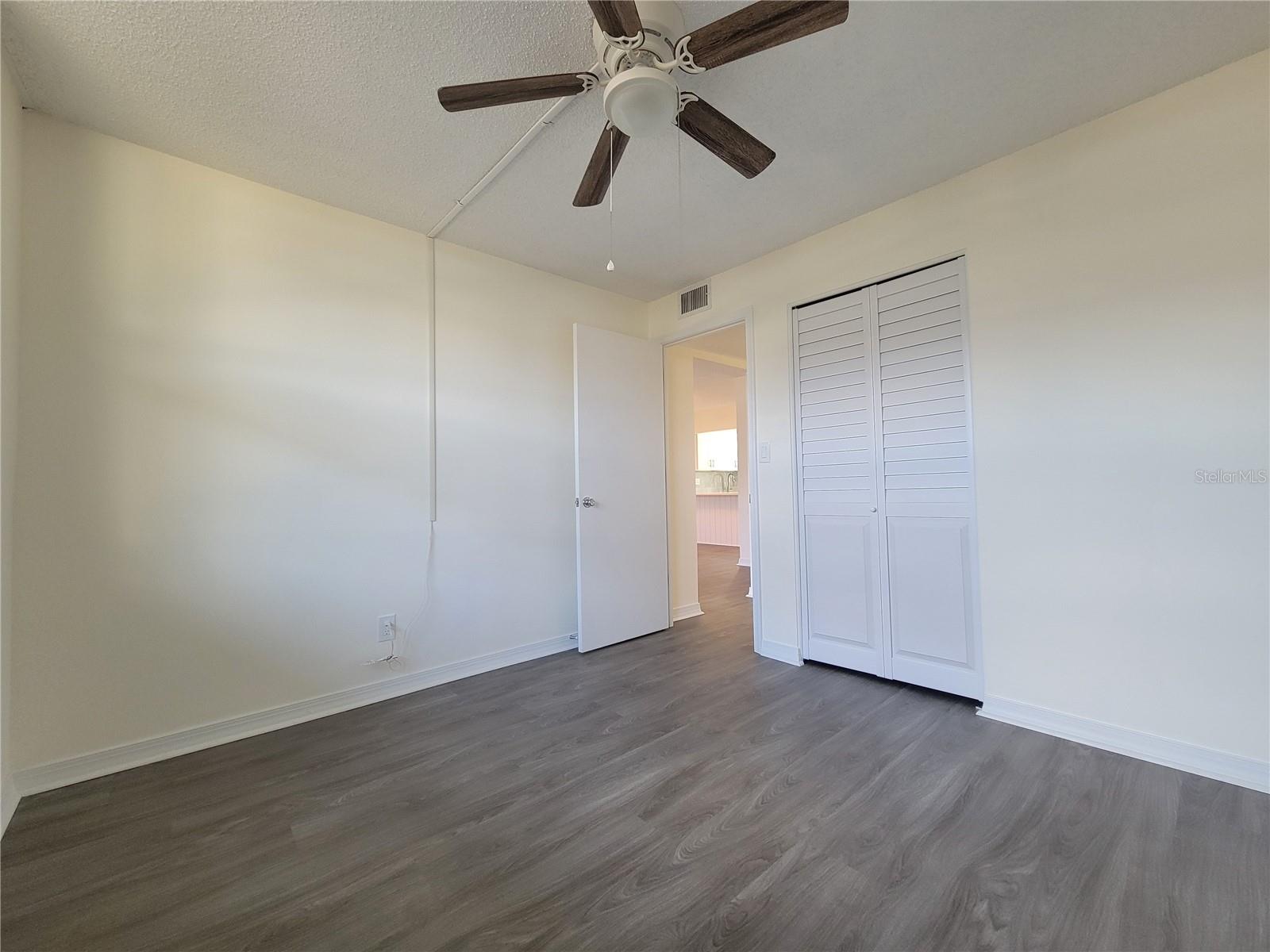 A north-facing second bedroom with ample natural light.