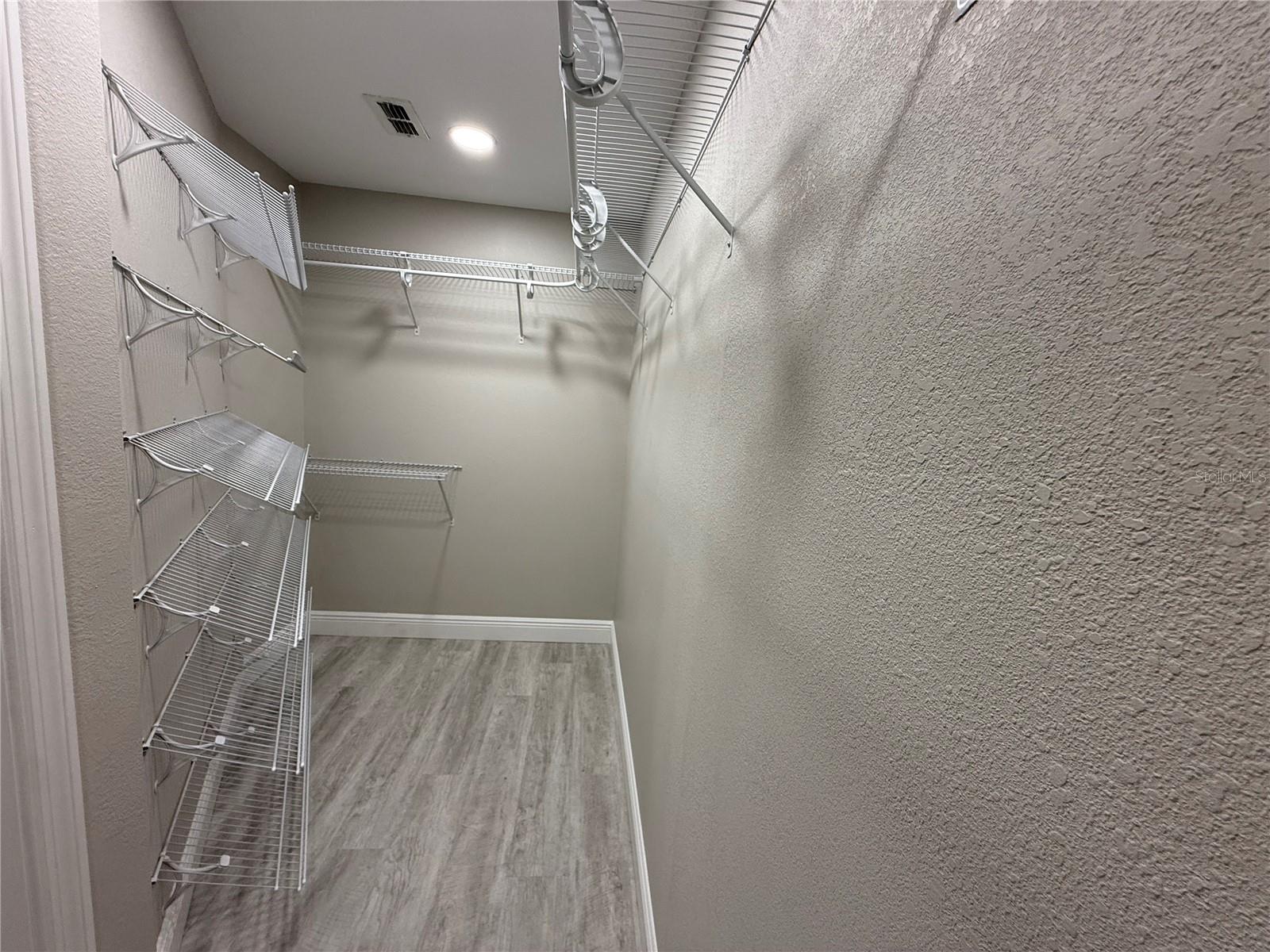 Expanded and Upgraded Walk-in Closet Primary Bedroom