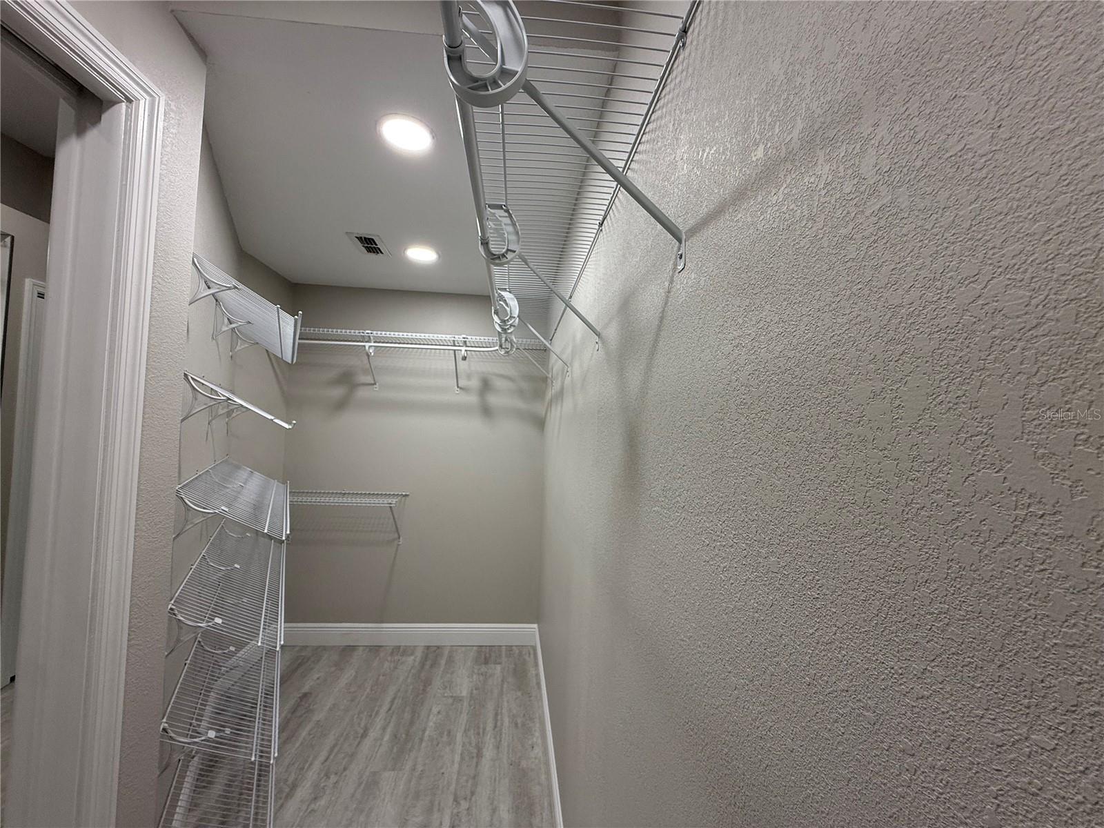 Expanded and Upgraded Walk-in Closet Primary Bedroom