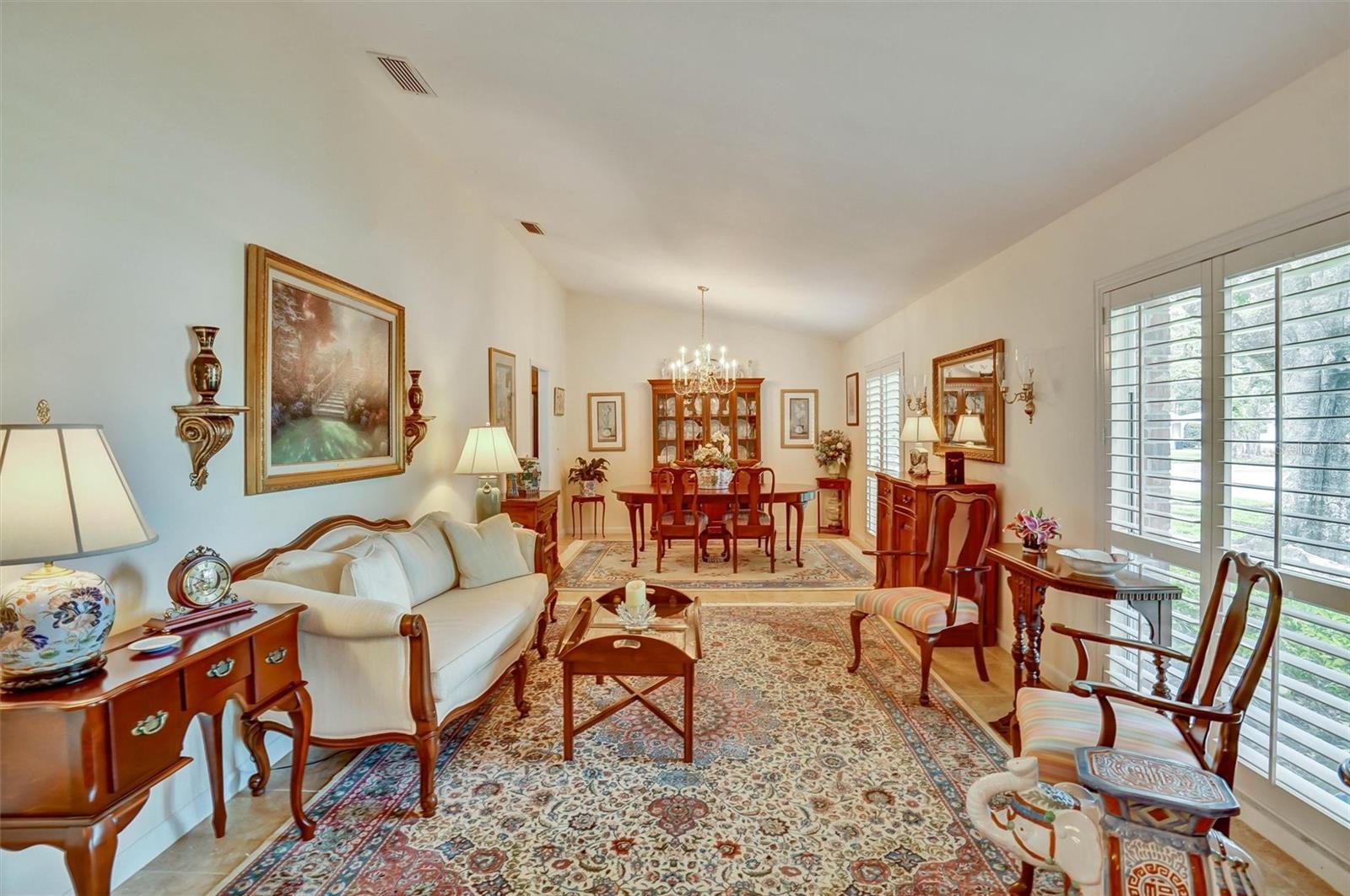Formal living and dining room with vaulted ceilings.