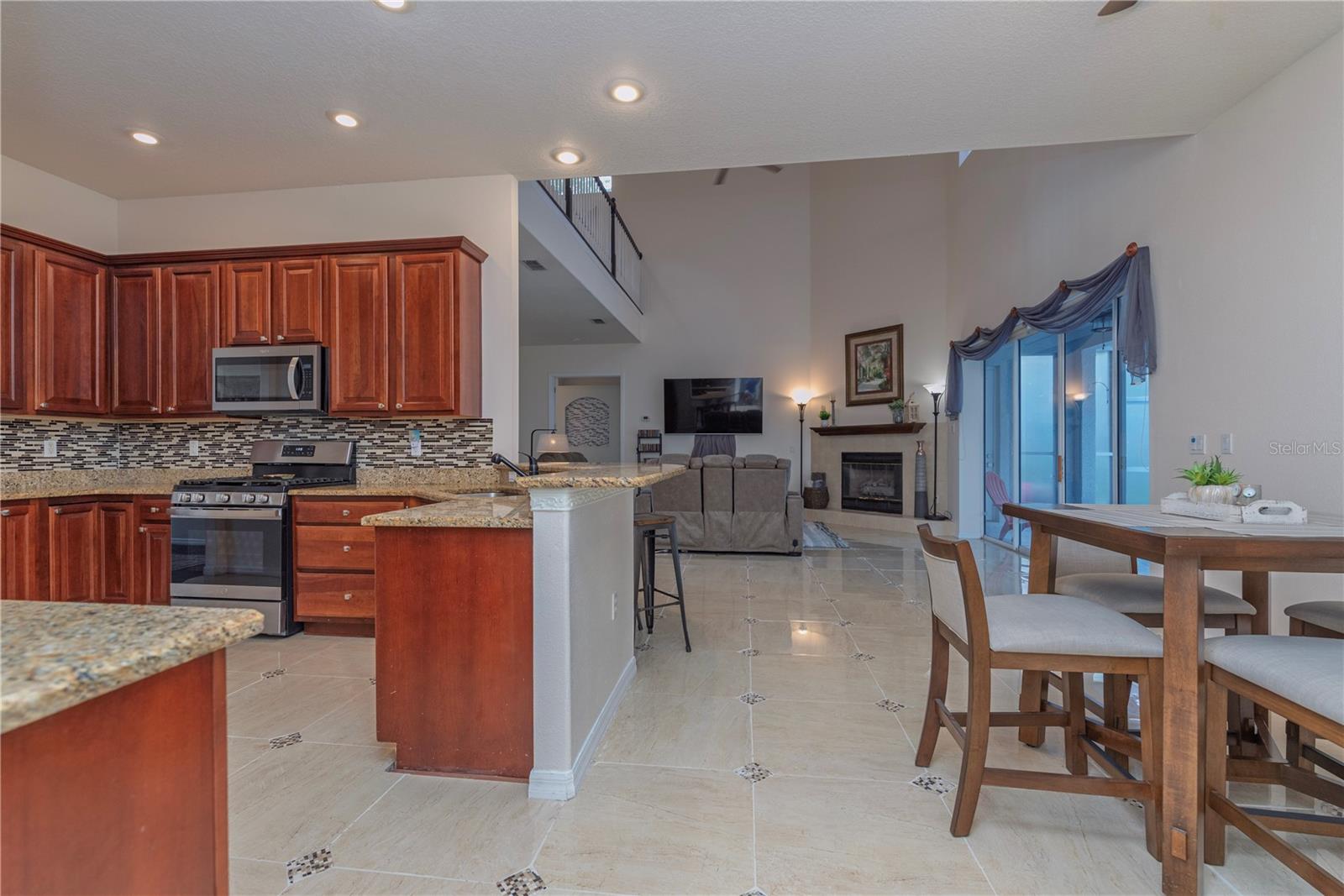 Bright, open-concept kitchen flowing seamlessly into the dining area.