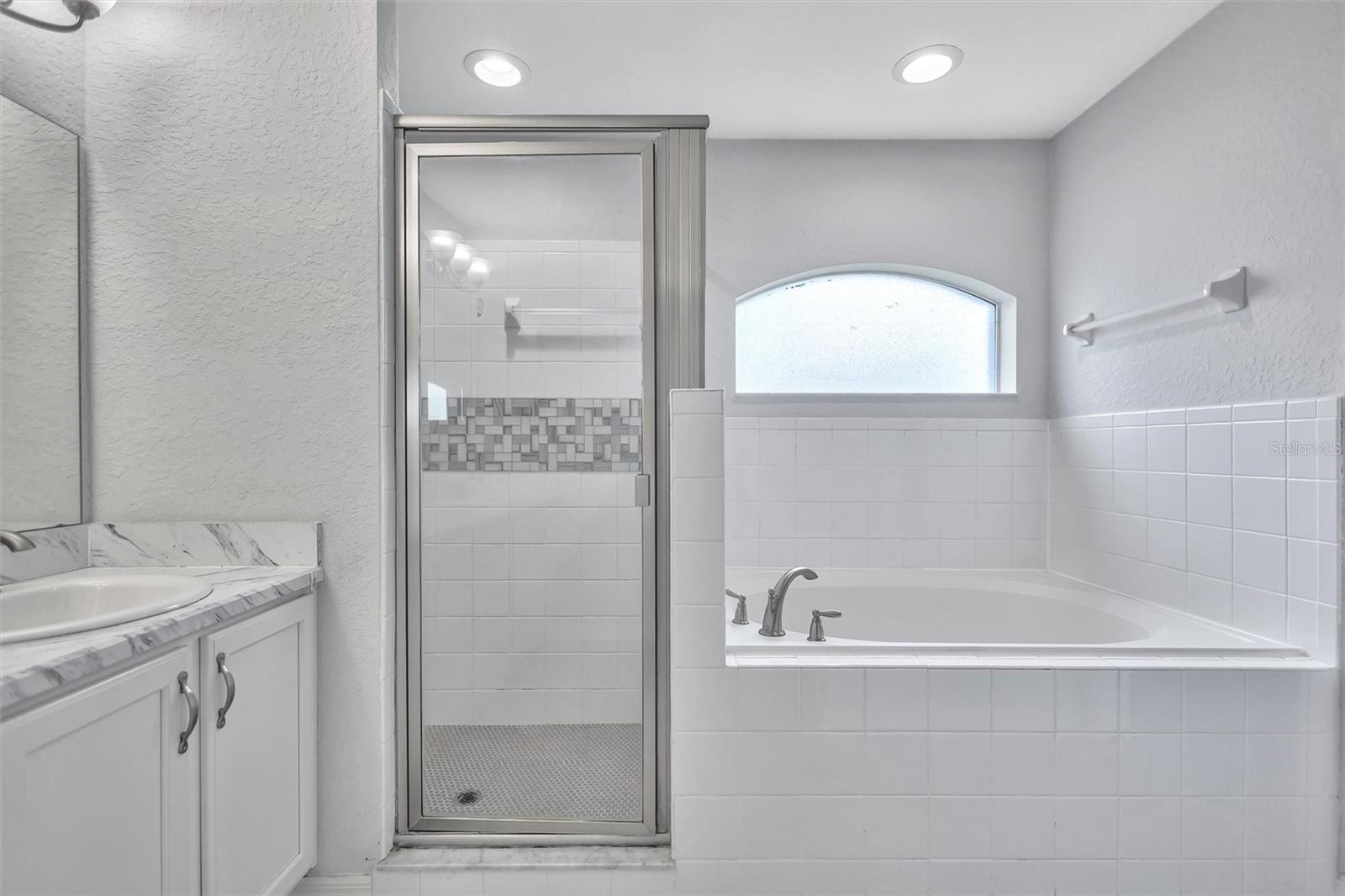 Primary Ensuite Featuring a Garden Tub & Walk-In Shower