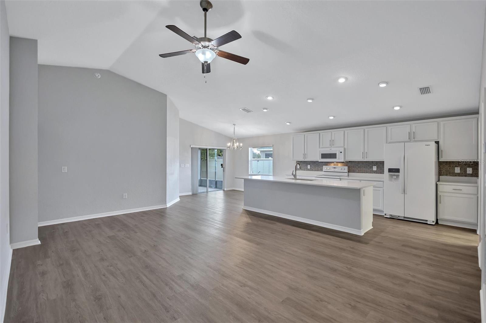 Open-Concept Layout that Seamlessly Connects the Living, Dining, and Kitchen