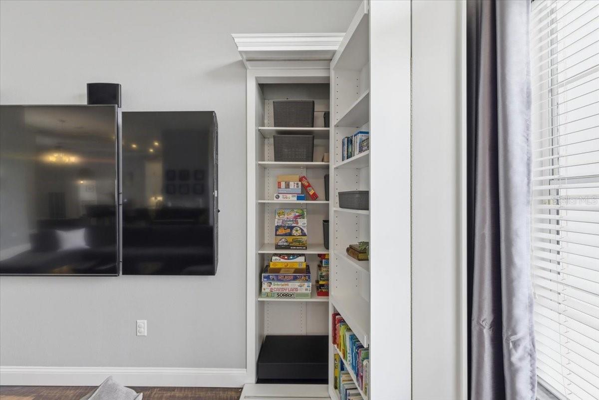 hidden bookcase storage in living room